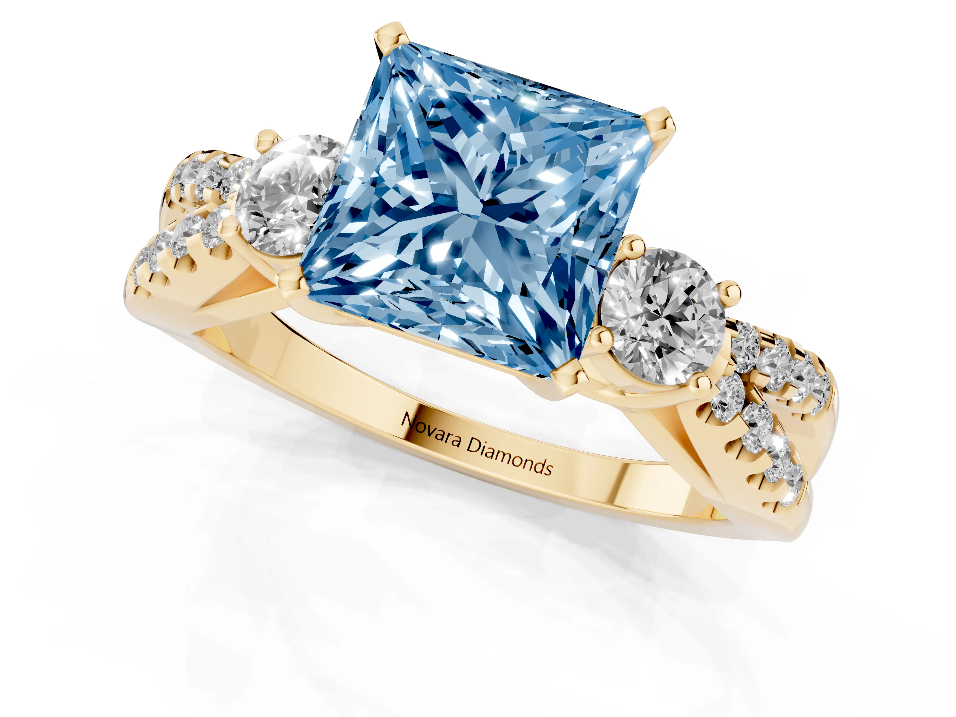 Fancy Blue Princess Cut Diamond Three-Stone Ring Set in Yellow gold with Pavé Split Shank and Prong Setting