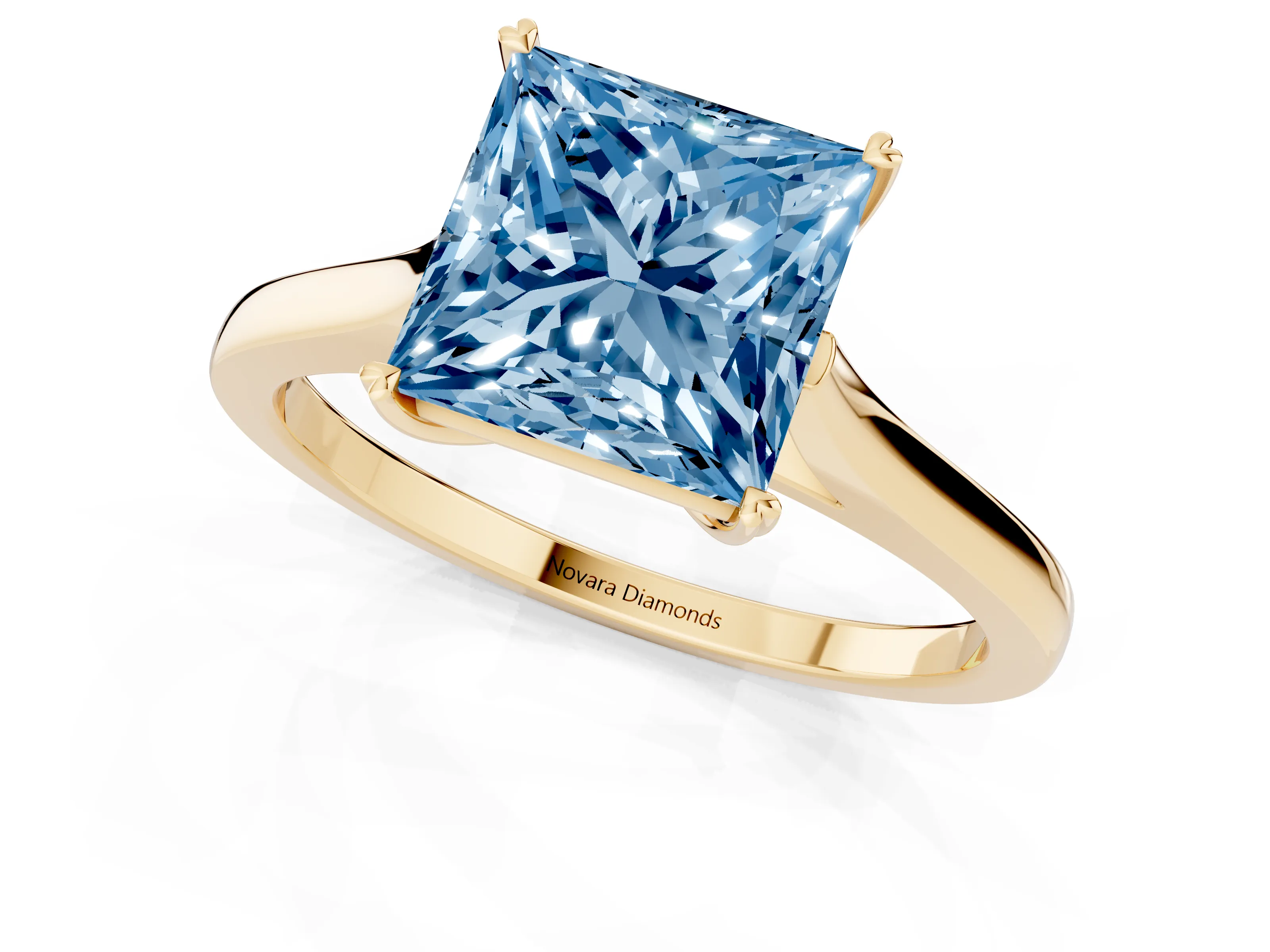 Fancy Blue Princess Cut Diamond Solitaire Heart Prong Engagement Ring Set in Yellow gold with Tapered Band