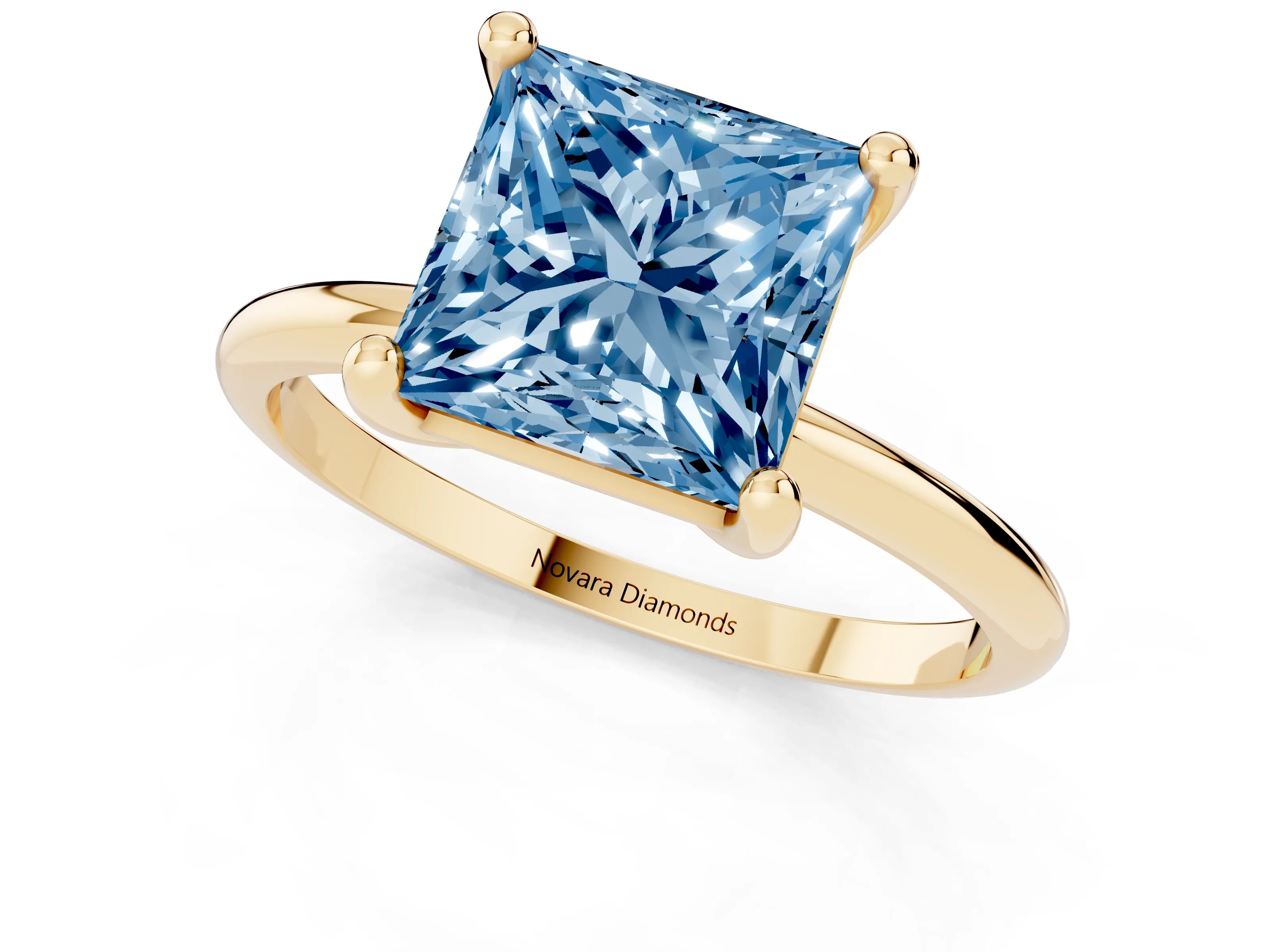 Fancy Blue Princess Cut Diamond Solitaire Ring Set in Yellow gold with Secure Prong Setting on a Classic Band