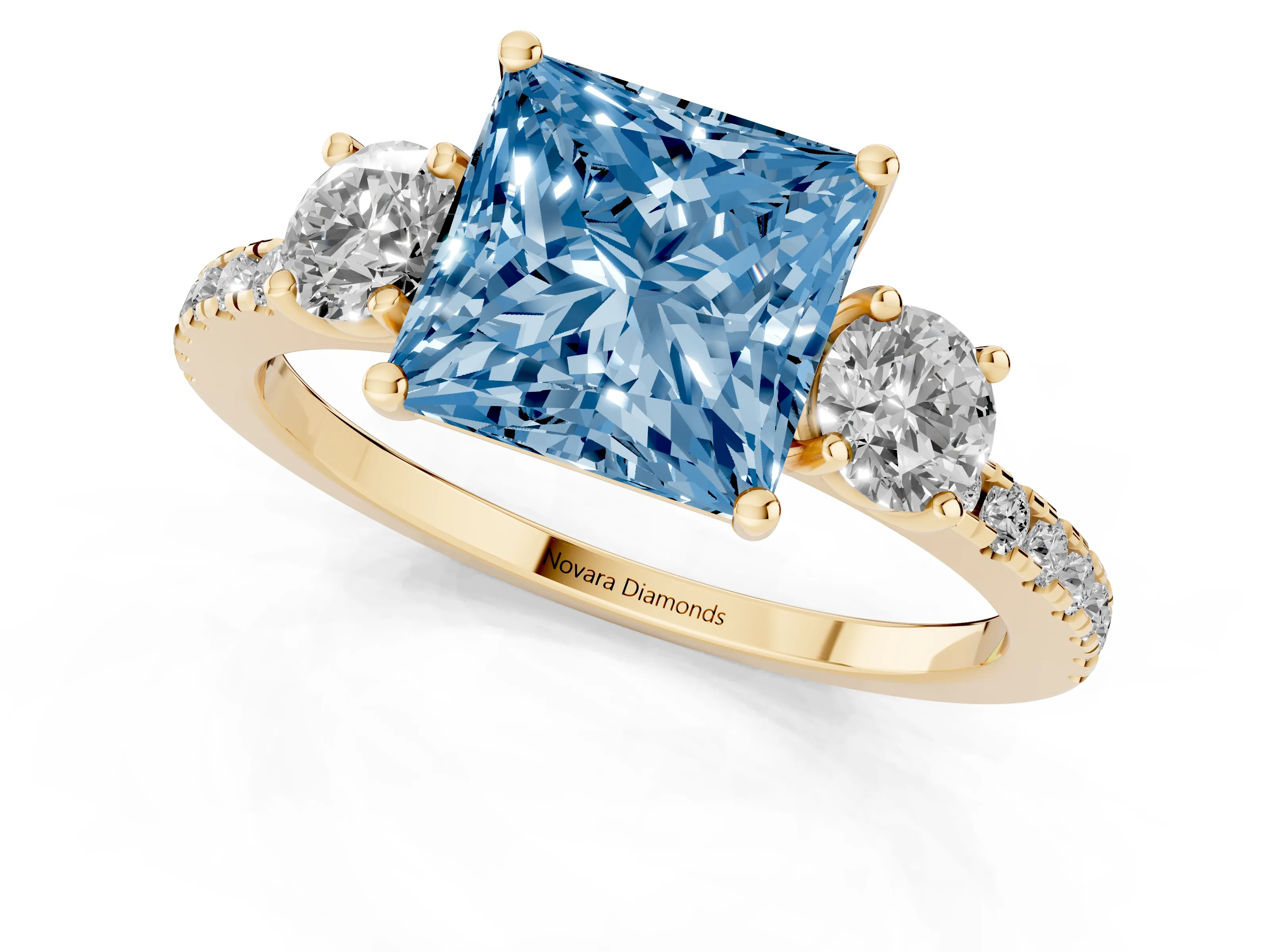 Fancy Blue Princess Cut Diamond Three-Stone Ring Set in Yellow gold with Pavé Band and Graduated Sides