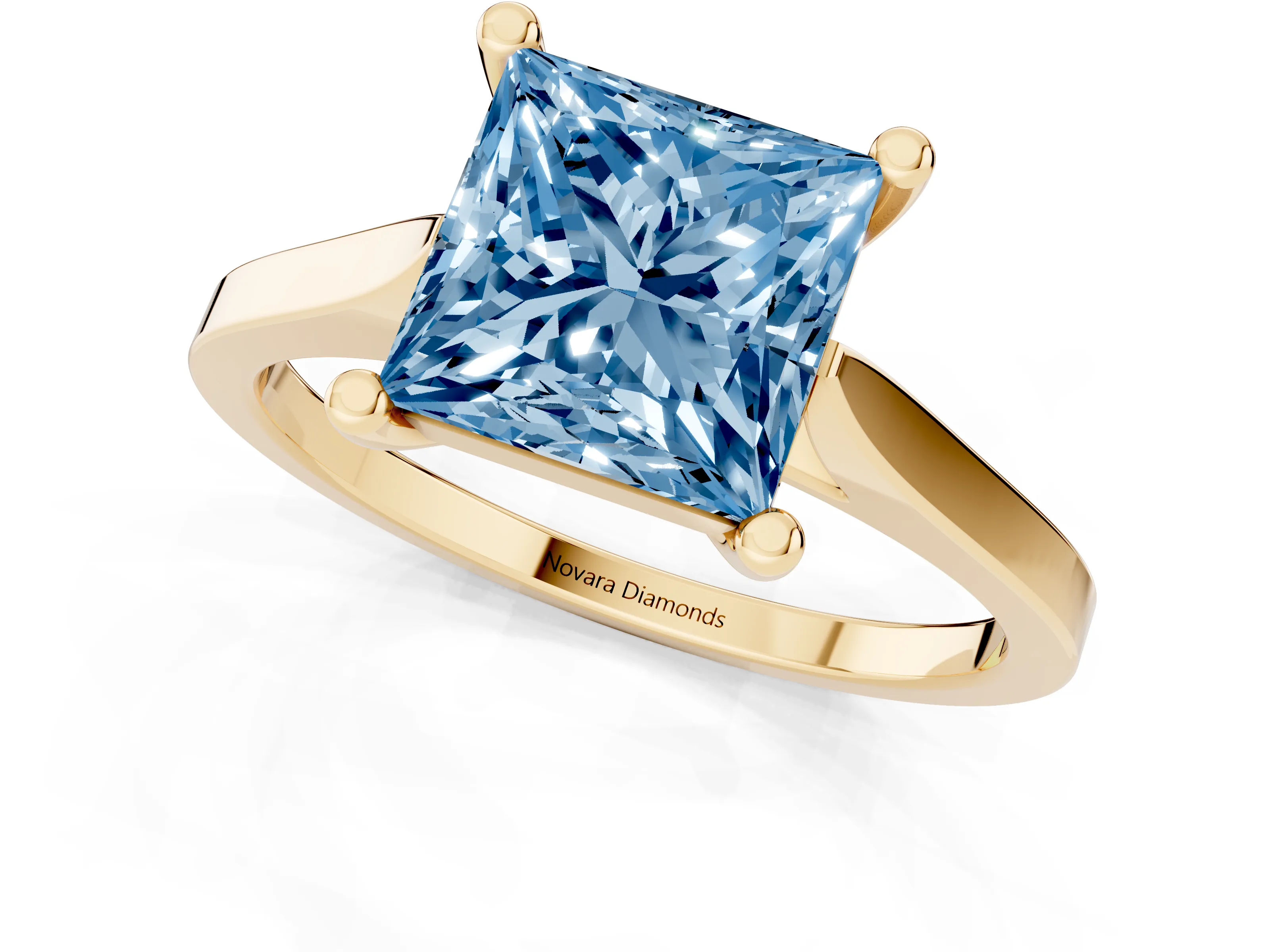 Fancy Blue Princess Cut Diamond Solitaire Ring Set in Yellow gold with Prong Setting and Tapered Band