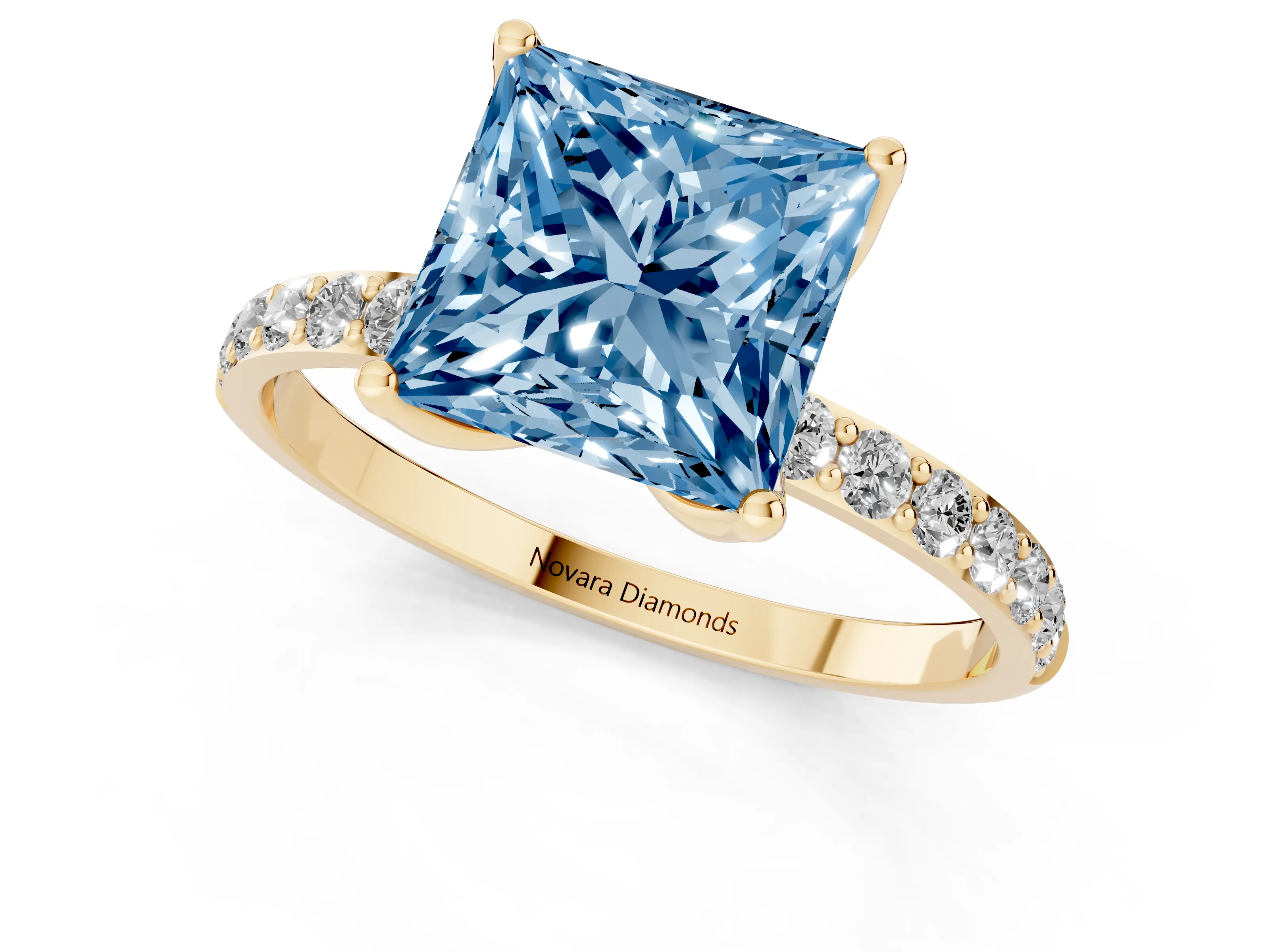 Fancy Blue Princess Cut Diamond Solitaire Engagement Ring Set in Yellow gold with Round Pavé Band and Prong Setting