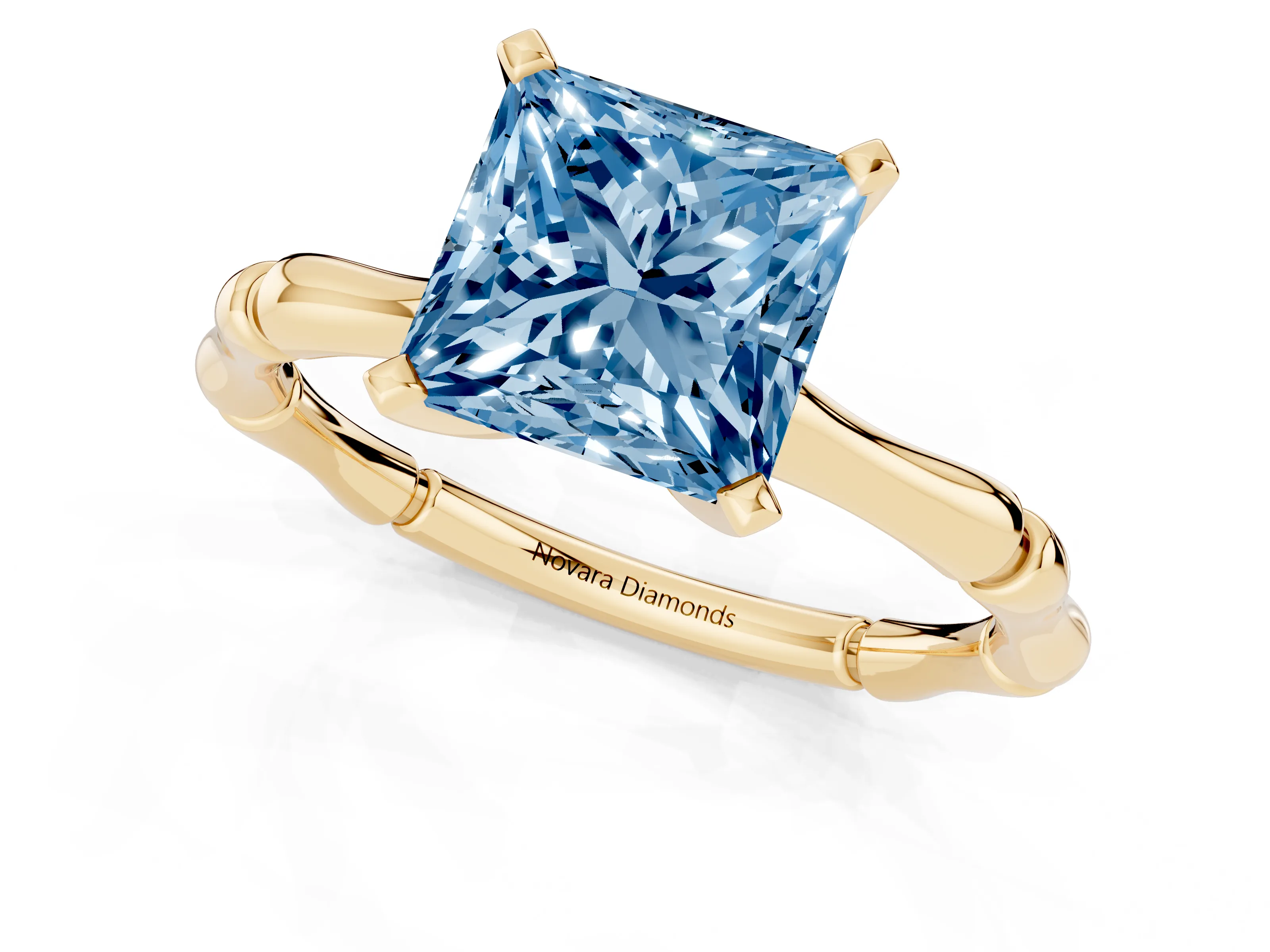 Fancy Blue Princess Cut Diamond Solitaire Ring Set in Yellow gold with Bamboo Band and Prong Setting