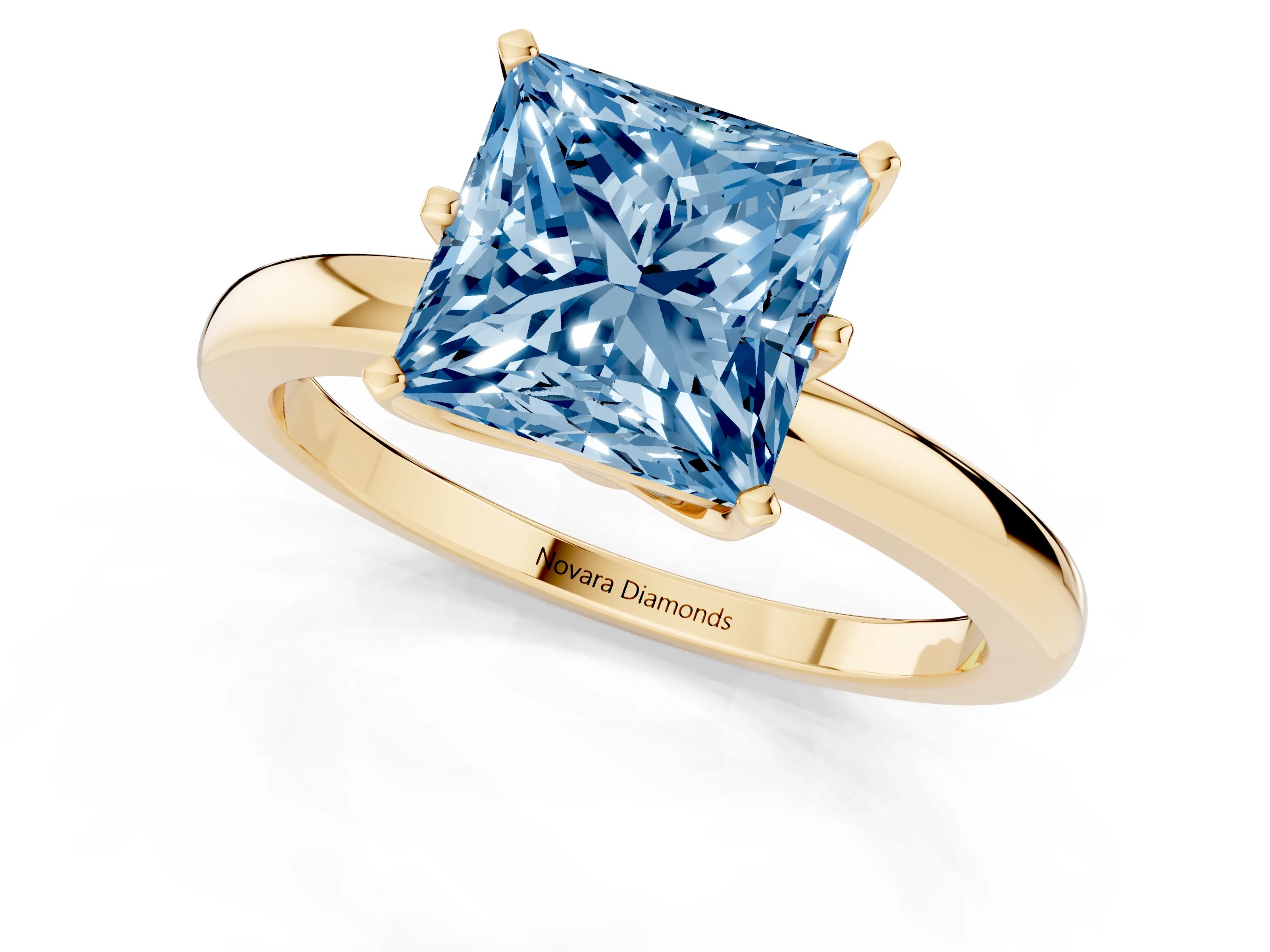 Fancy Blue Princess Cut Diamond Solitaire Ring Set in Yellow gold with Raised Prong Setting on a Classic Band