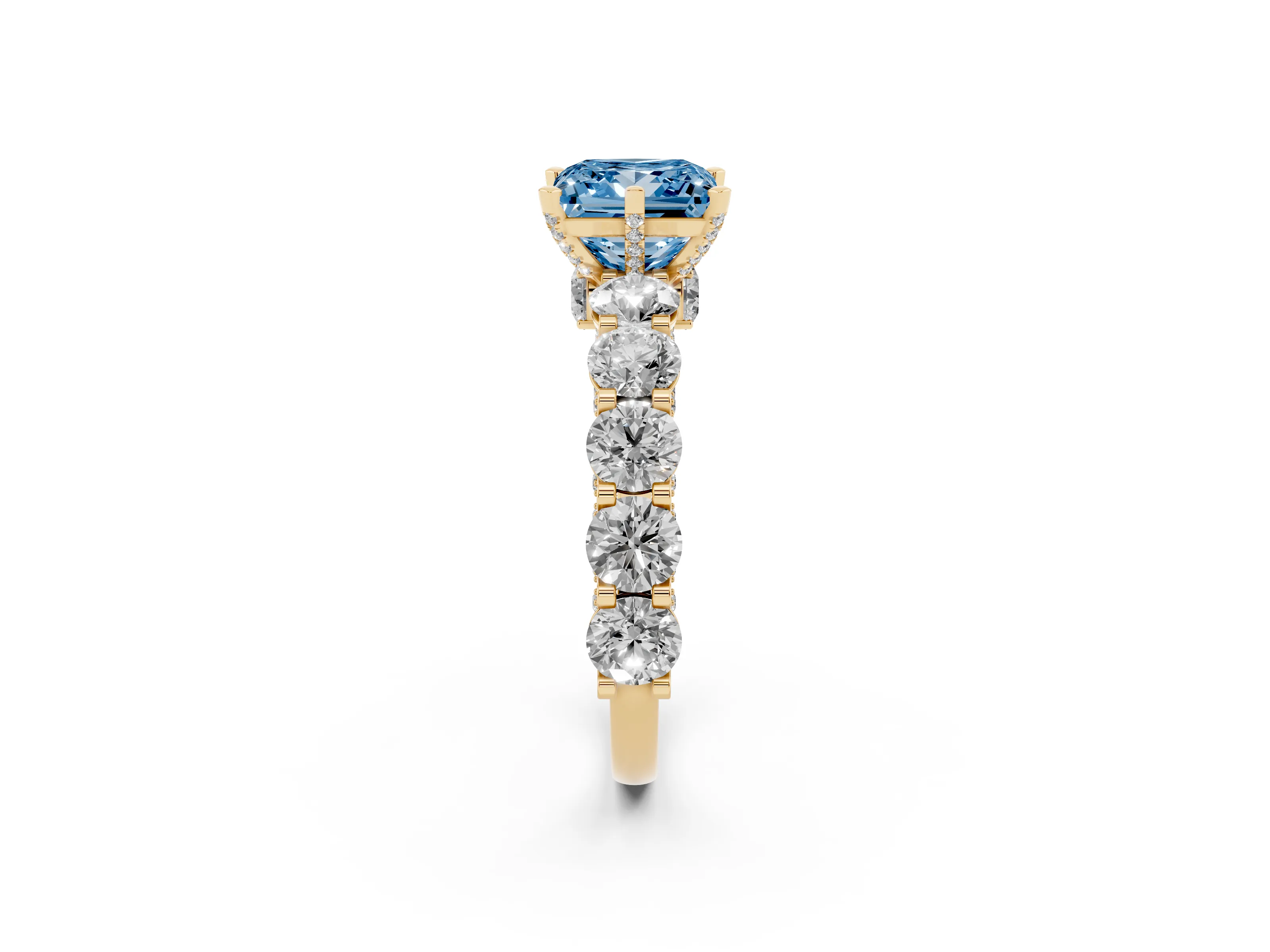 Fancy Blue Princess Cut Diamond Side Stone Ring Set in Yellow gold with Alternating Round and Oval Side Stones