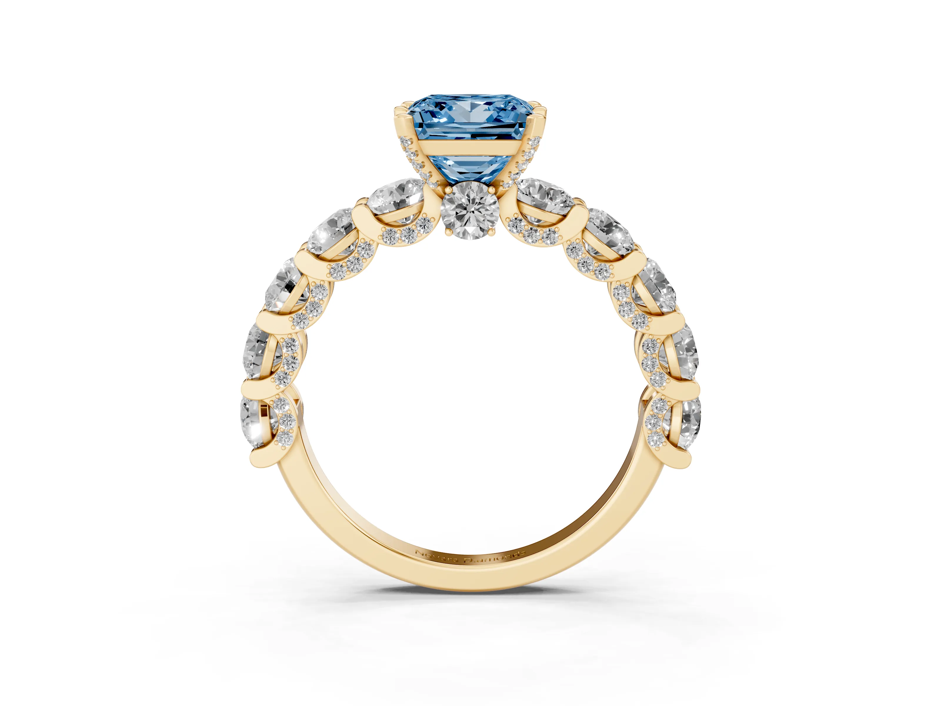 Fancy Blue Princess Cut Diamond Side Stone Ring Set in Yellow gold with Alternating Round and Oval Side Stones
