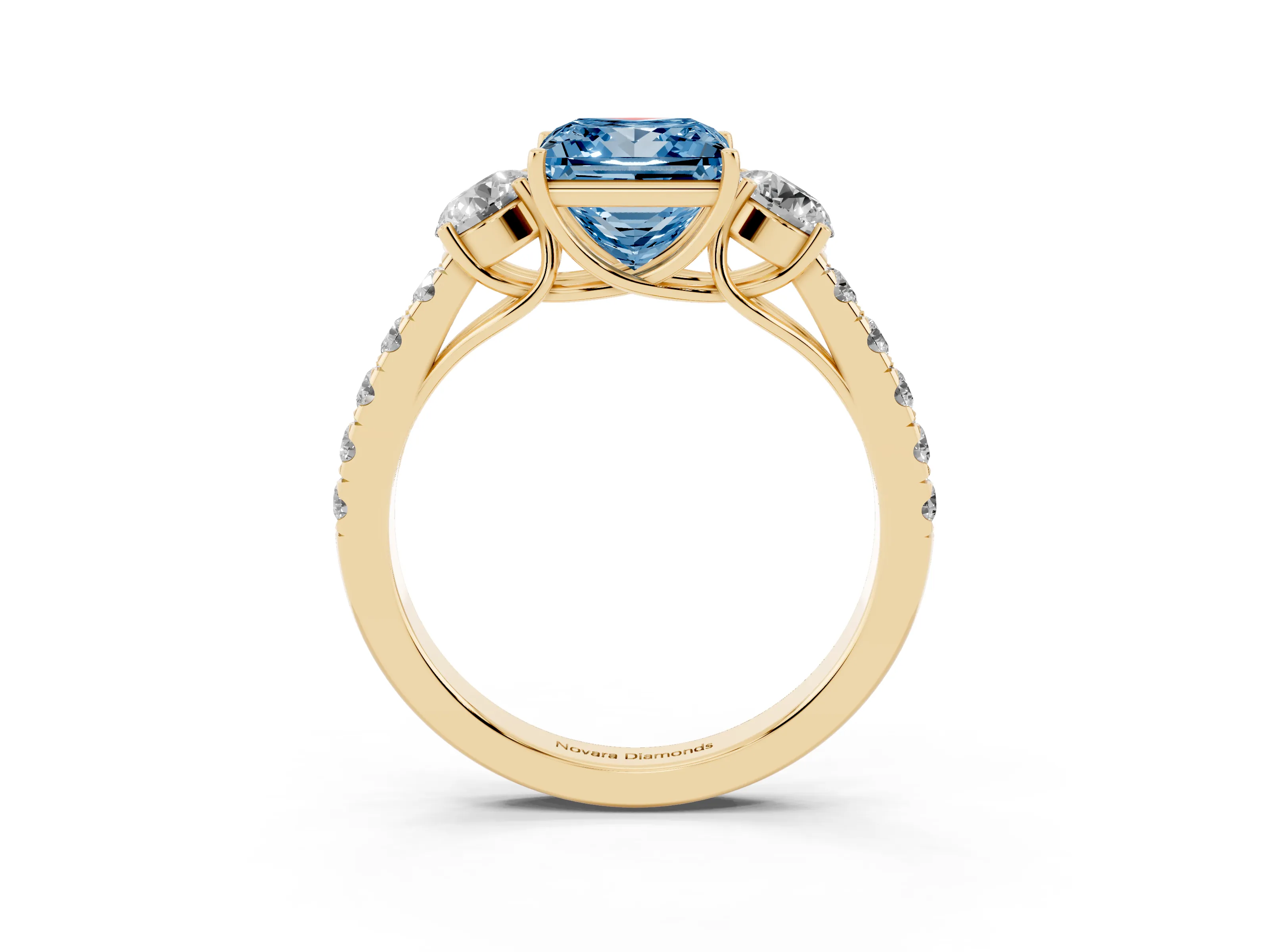 Fancy Blue Princess Cut Diamond Three-Stone Ring Set in Yellow gold with Round Side Stones and Delicate Pavé Band