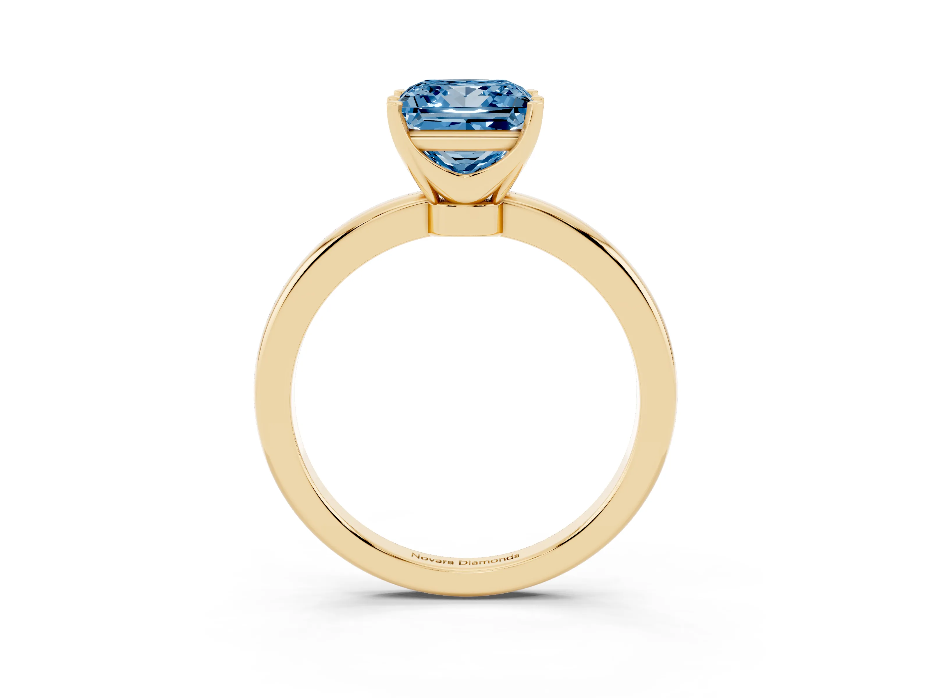 Fancy Blue Princess Cut Diamond Solitaire Ring Set in Yellow gold with Raised Prong Setting on a Classic Band