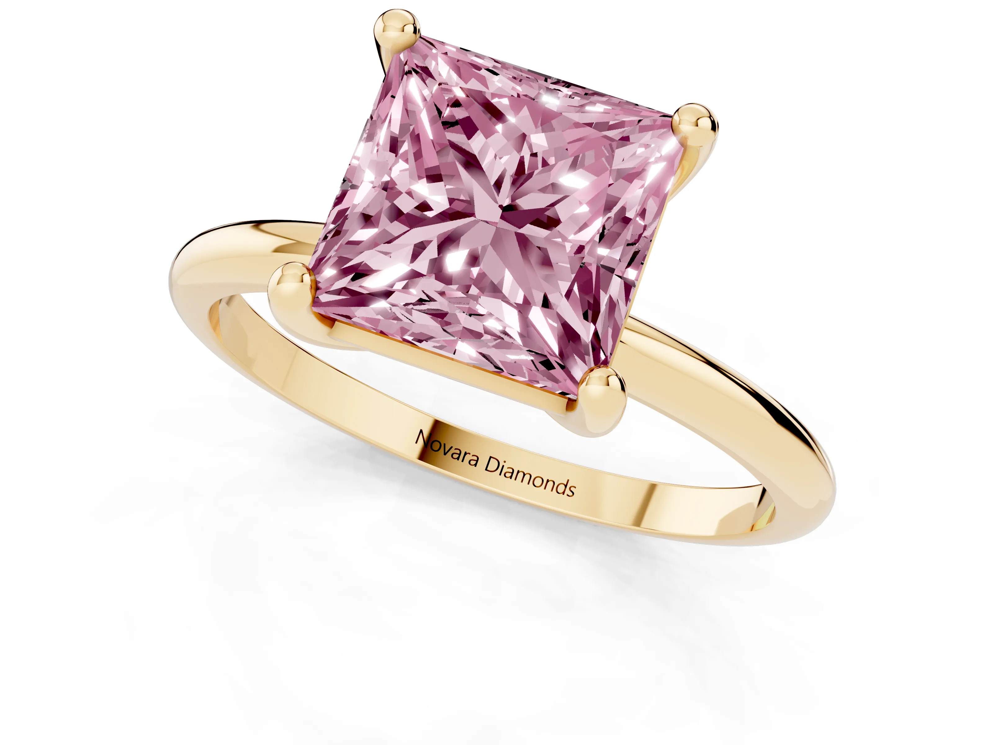 Fancy Pink Princess Cut Diamond Solitaire Ring Set in Yellow gold with Secure Prong Setting on a Classic Band