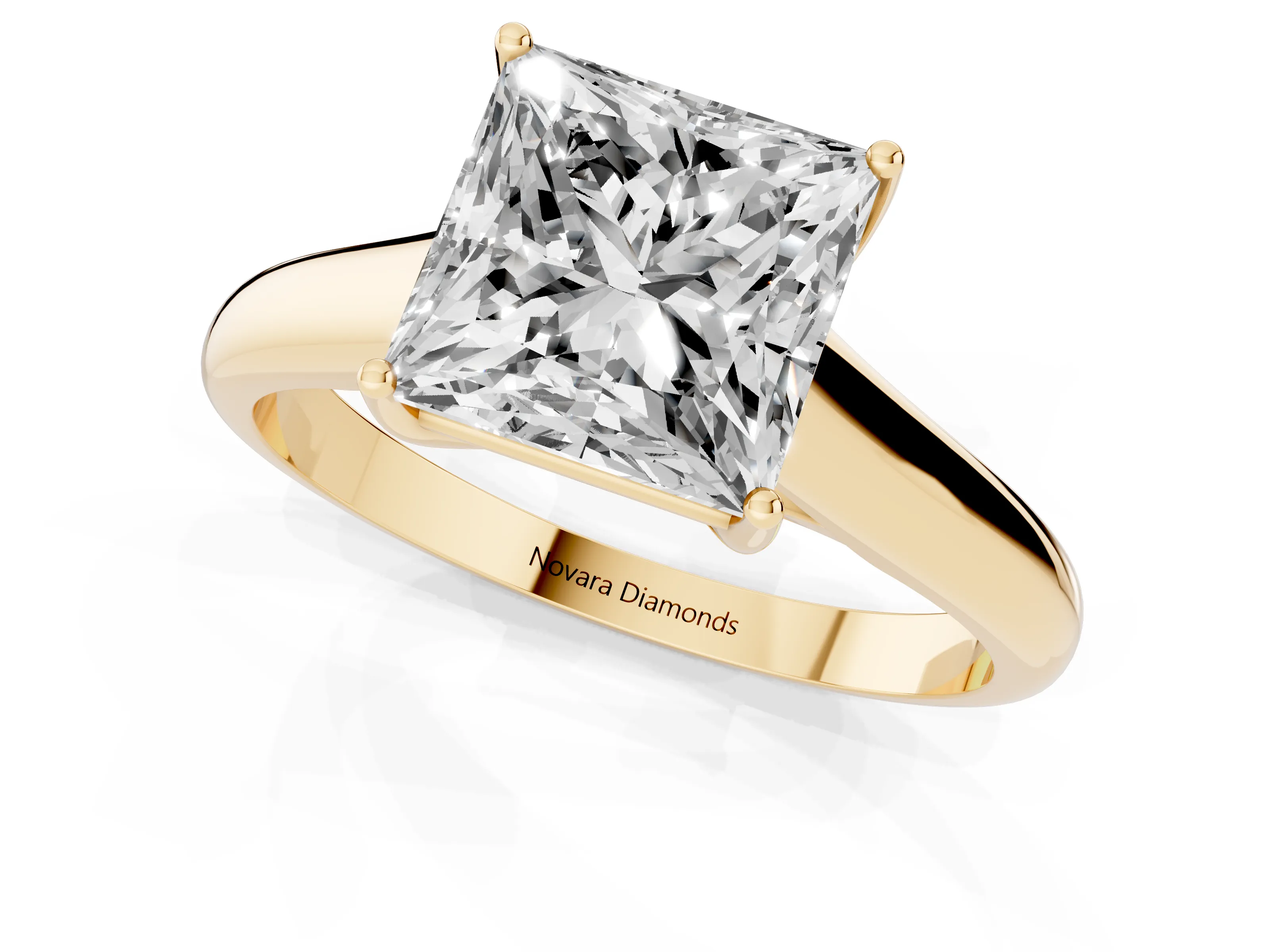 Princess Cut Diamond Solitaire Engagement Ring Set in Yellow gold with Subtly Tapered Band and Prong Setting