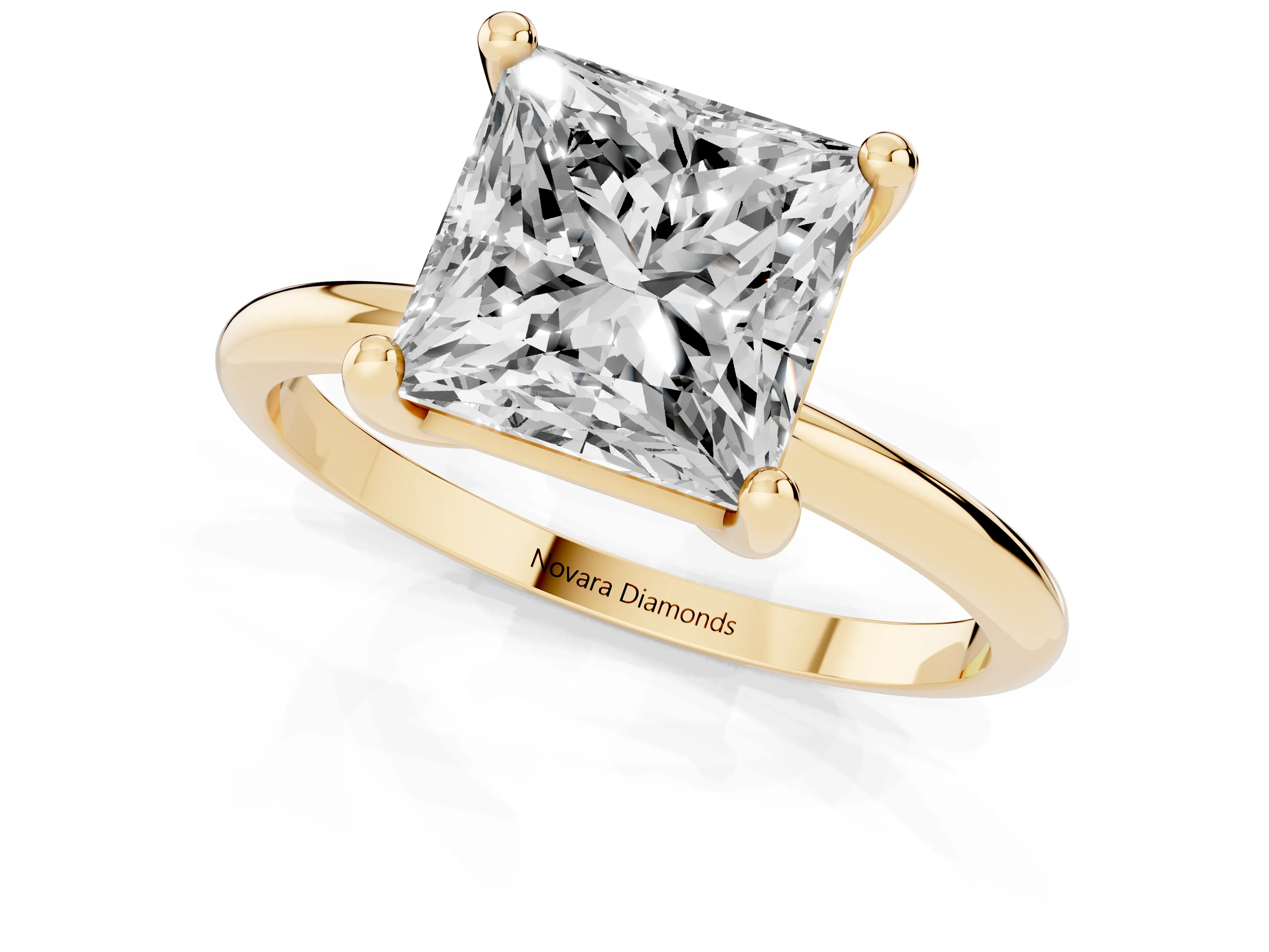 Princess Cut Diamond Solitaire Ring Set in Yellow gold with Secure Prong Setting on a Classic Band