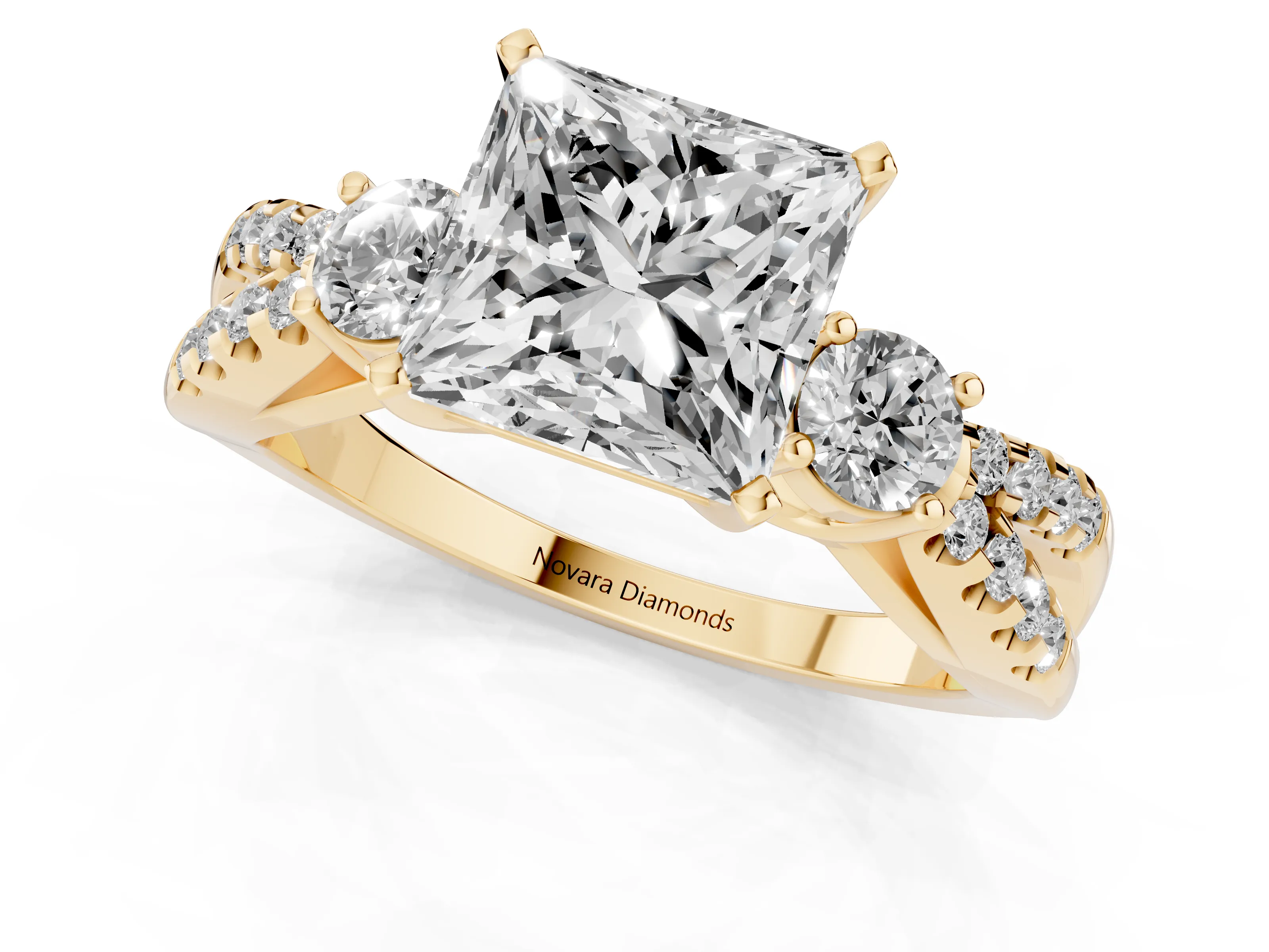 Princess Cut Diamond Three-Stone Ring Set in Yellow gold with Pavé Split Shank and Prong Setting