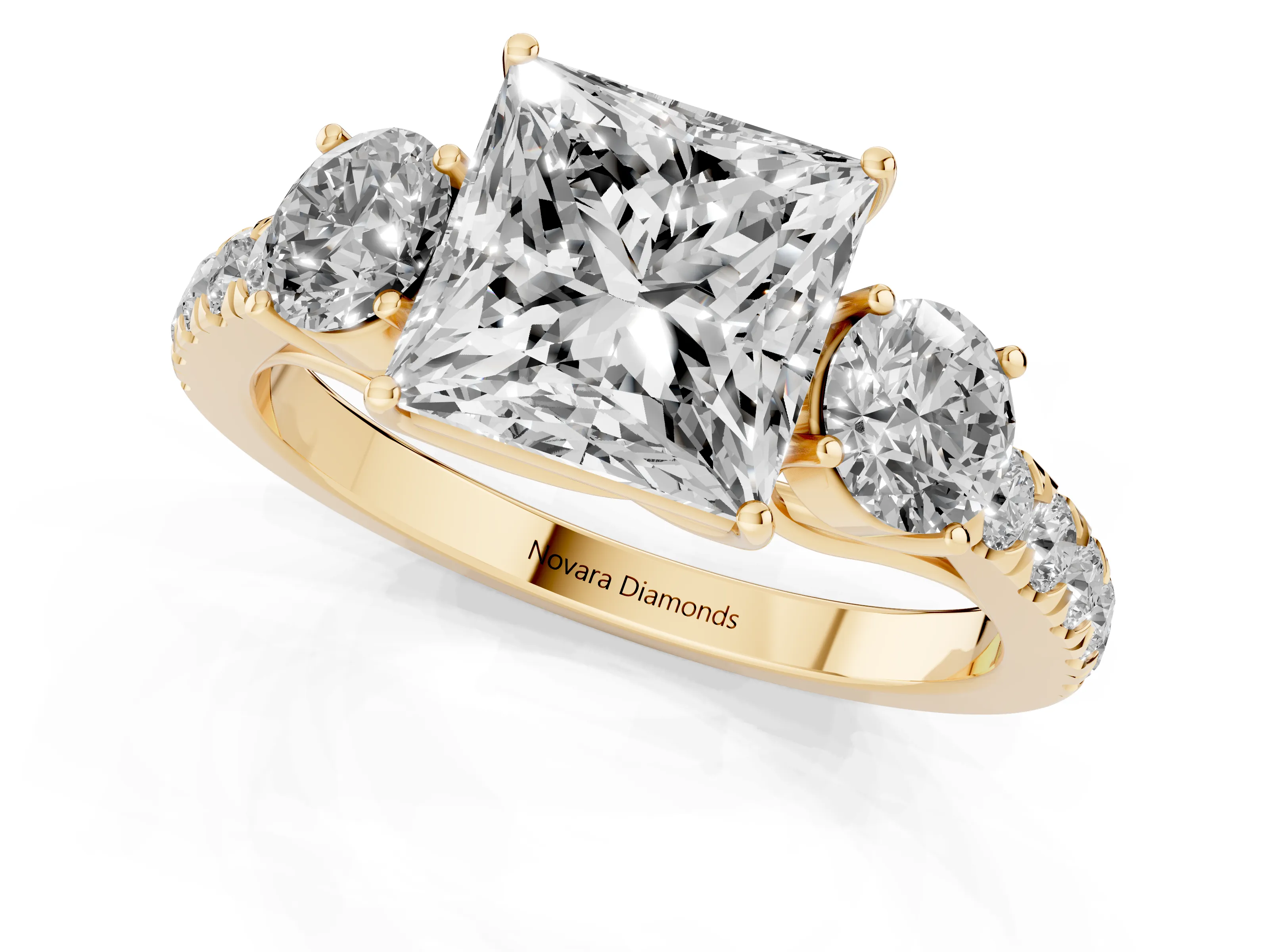 Princess Cut Diamond Three-Stone Ring Set in Yellow gold with Round Side Stones and Delicate Pavé Band
