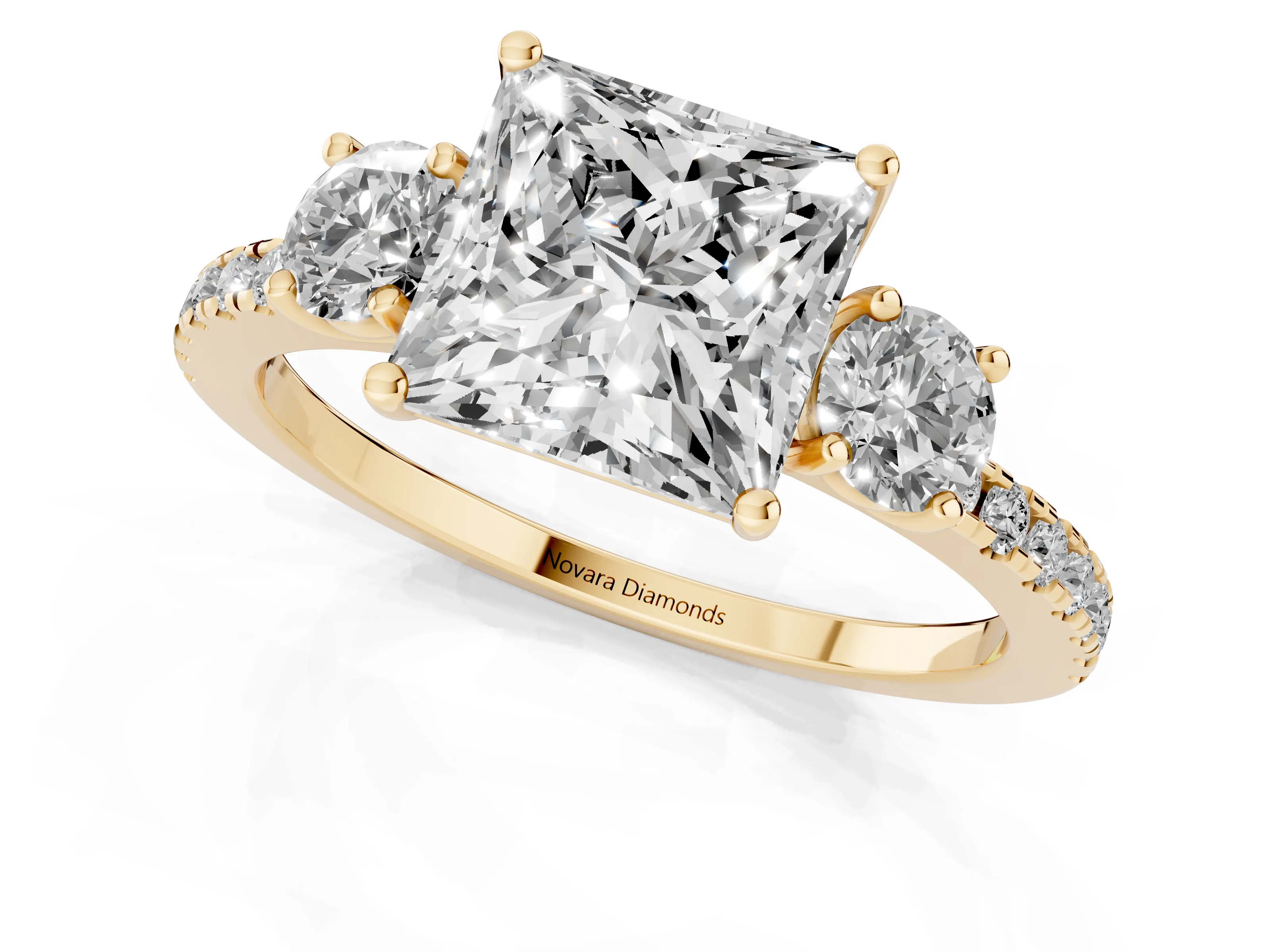 Princess Cut Diamond Three-Stone Ring Set in Yellow gold with Pavé Band and Graduated Sides