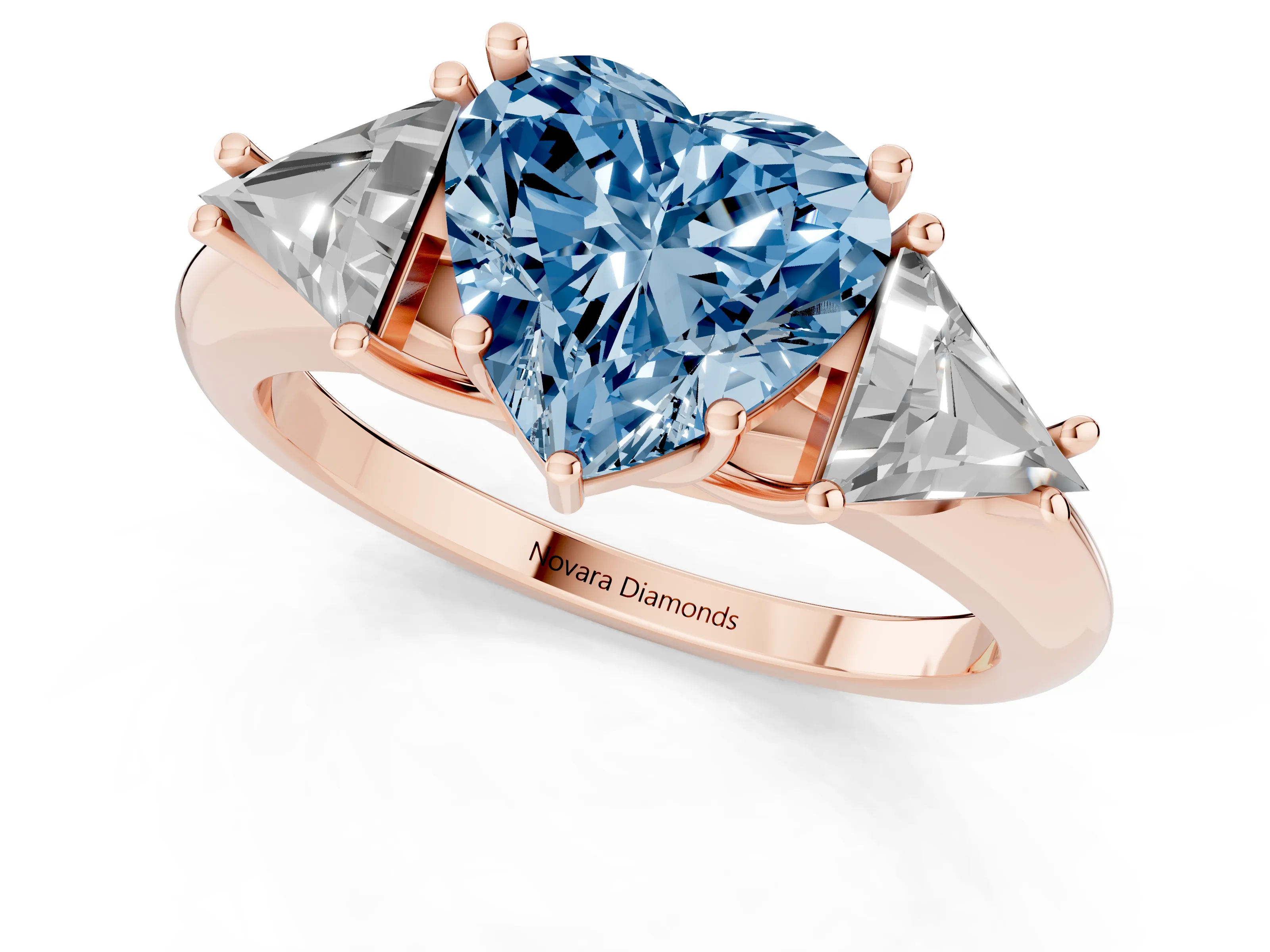 Fancy Blue Heart Cut Diamond Three-Stone Engagement Ring Set in Rose gold with Trillion Side Stones
