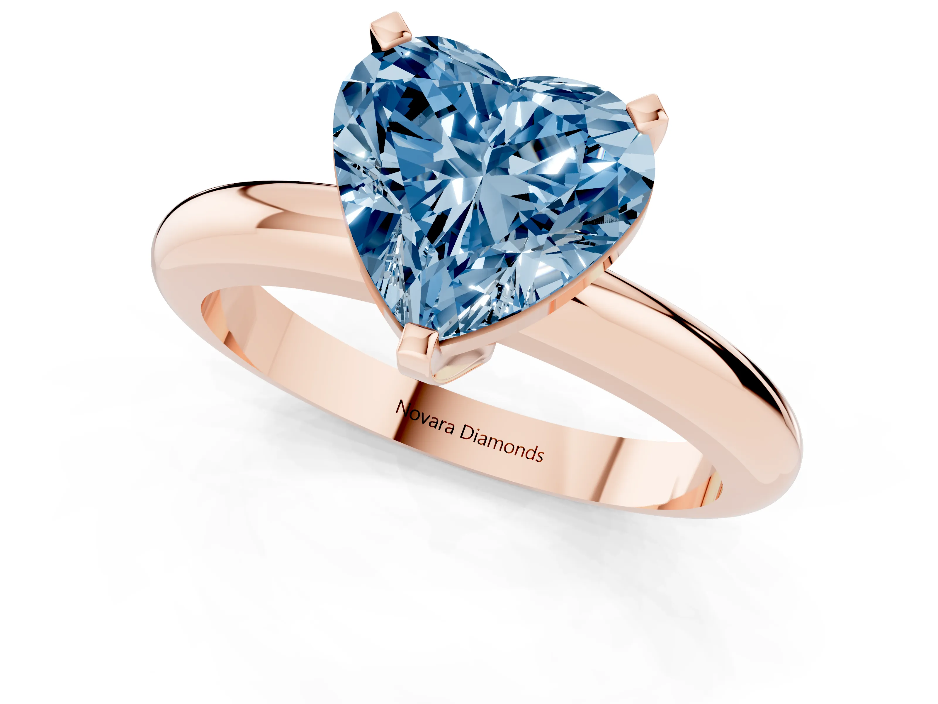 Fancy Blue Heart Cut Diamond Solitaire Engagement Ring Set in Rose gold with Round Band and Prong Setting
