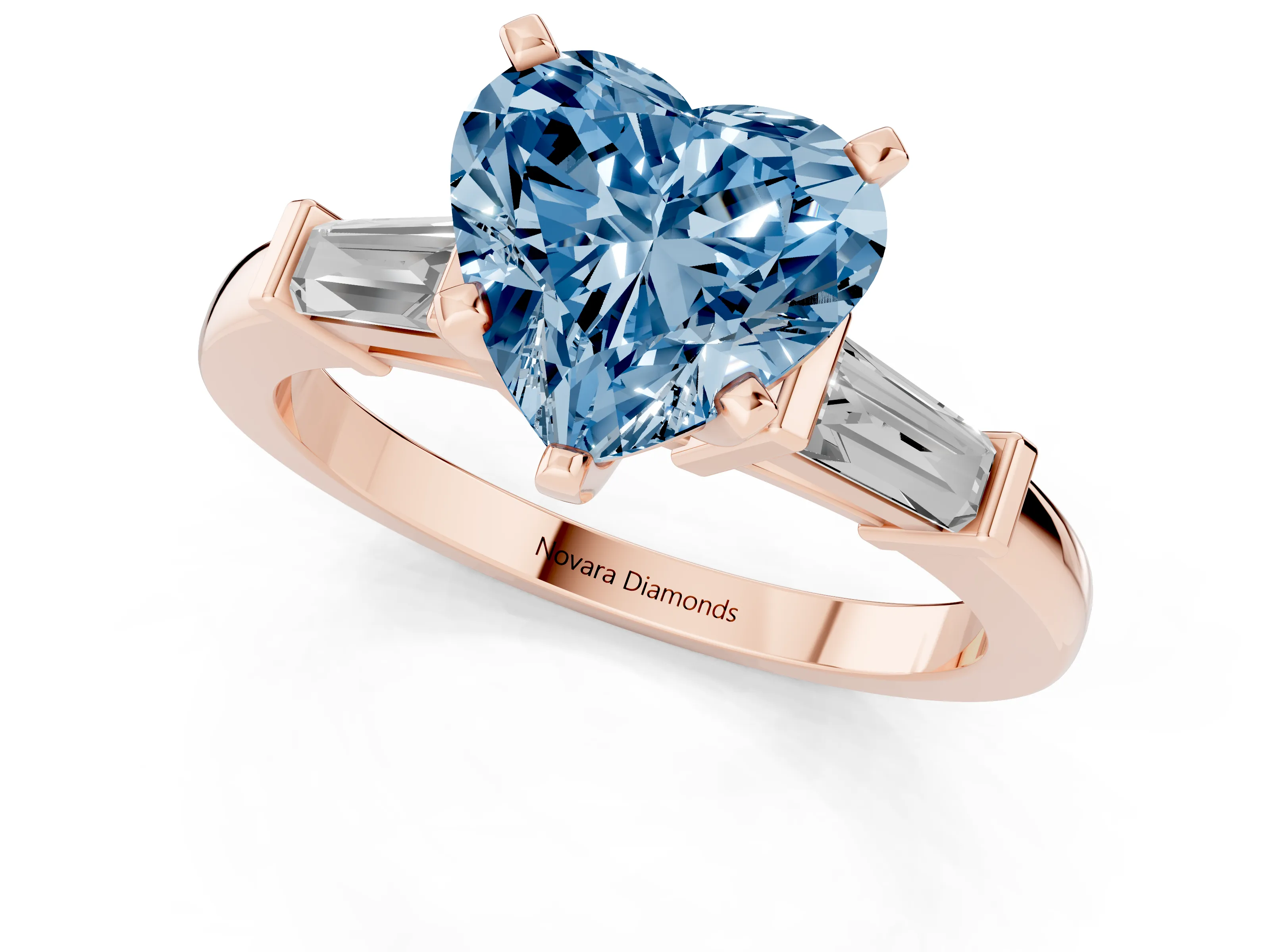 Fancy Blue Heart Cut Diamond Solitaire Ring Set in Rose gold with Tapered Baguette Accents and Prong Setting