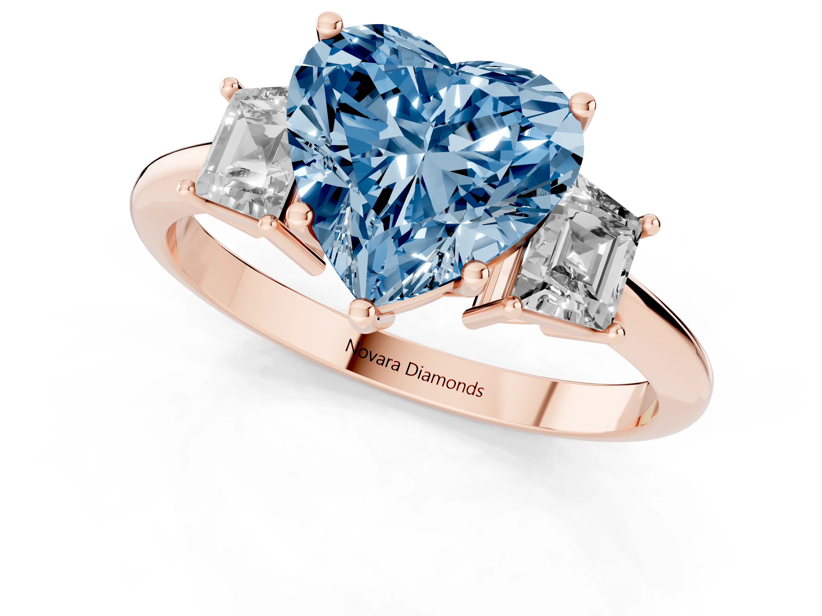 Fancy Blue Heart Cut Diamond Three-Stone Ring Set in Rose gold with Trapezoid Side Stones and Prong Setting