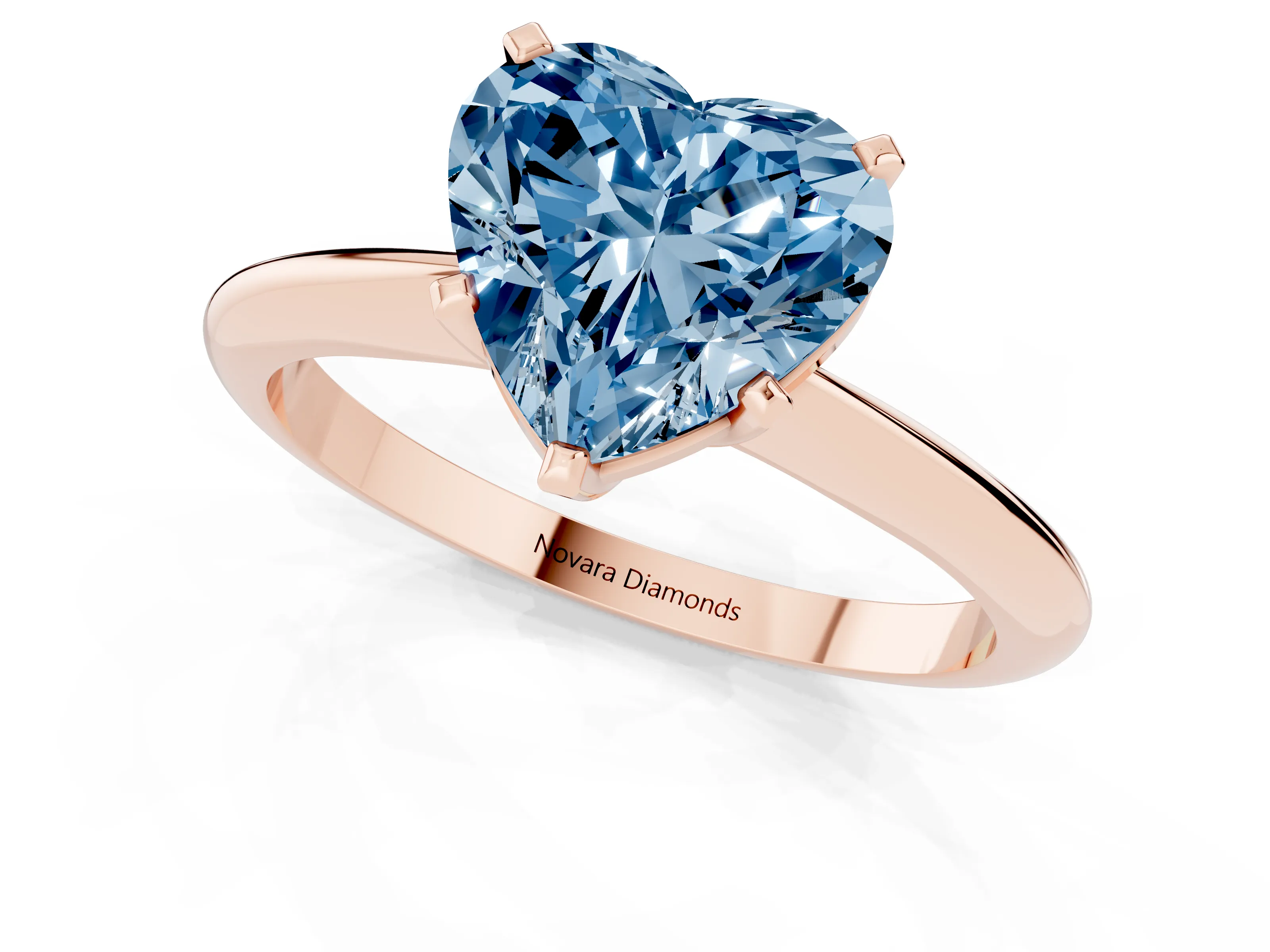 Fancy Blue Heart Cut Diamond Solitaire Ring Set in Rose gold with Prong Setting on a Plain Round Band