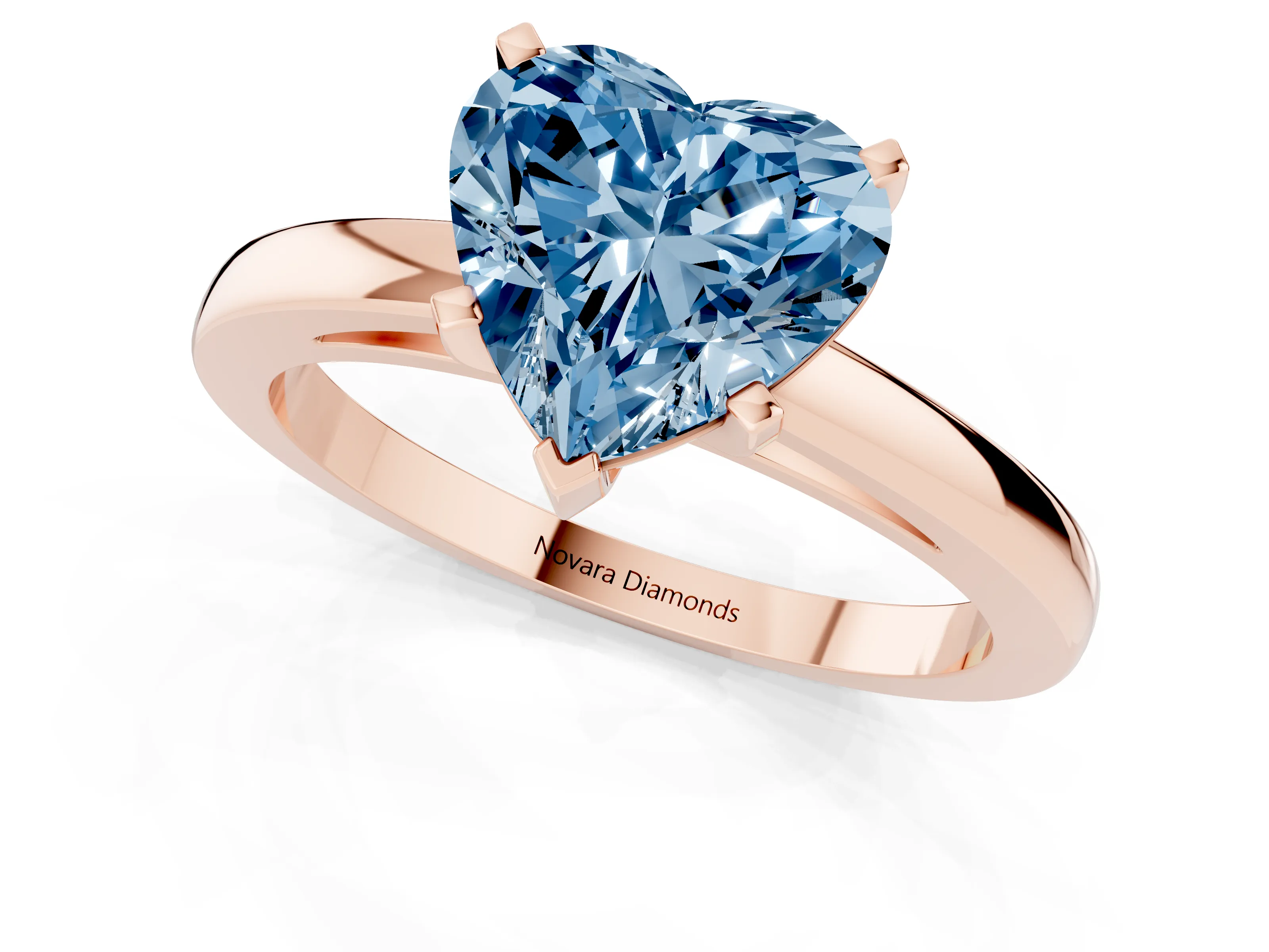 Fancy Blue Heart Cut Diamond Solitaire Engagement Ring Set in Rose gold with Prong Setting on a Classic Band