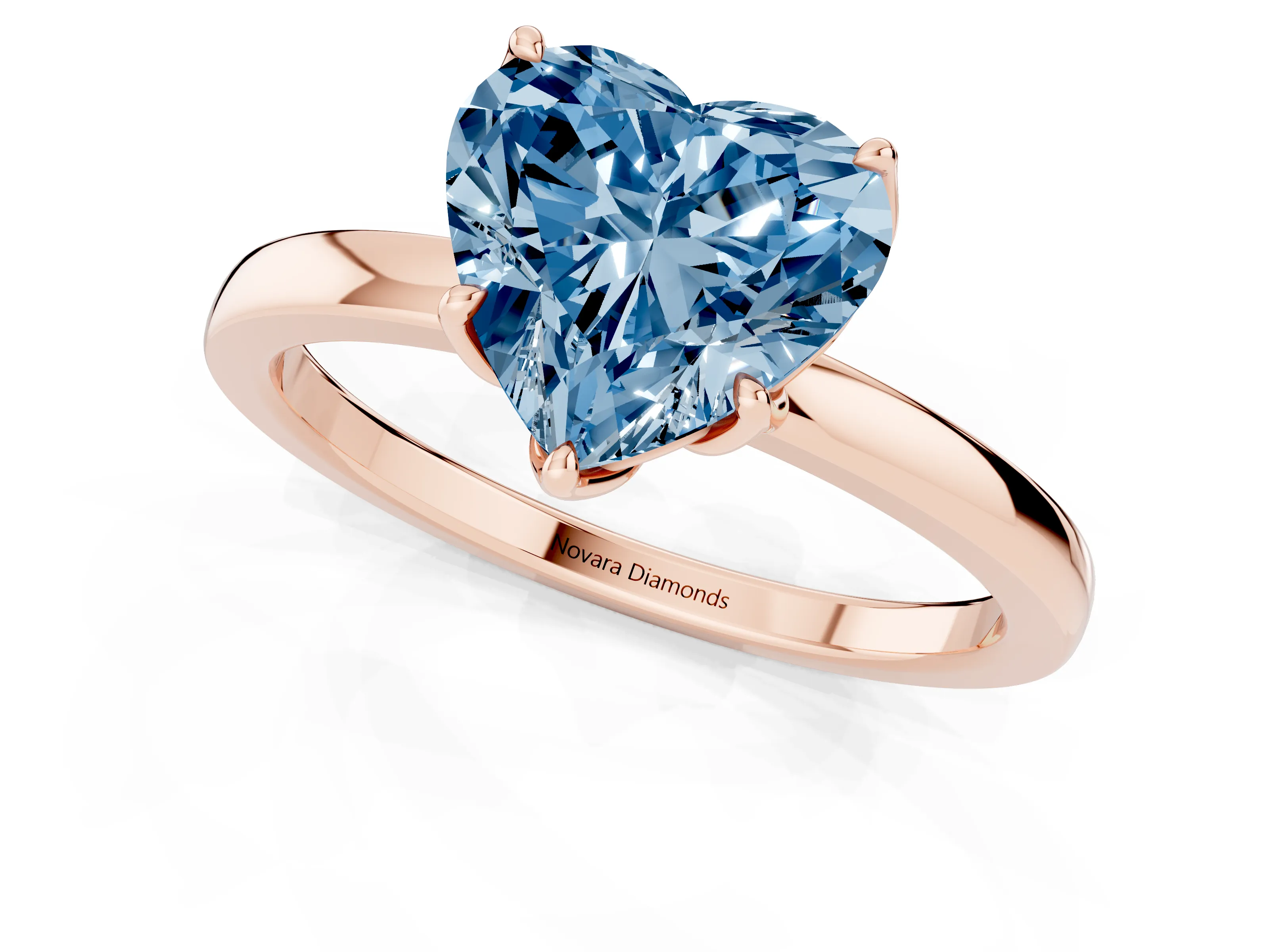 Fancy Blue Heart Cut Diamond Solitaire Ring Set in Rose gold with Prong Setting and Thin Polished Band