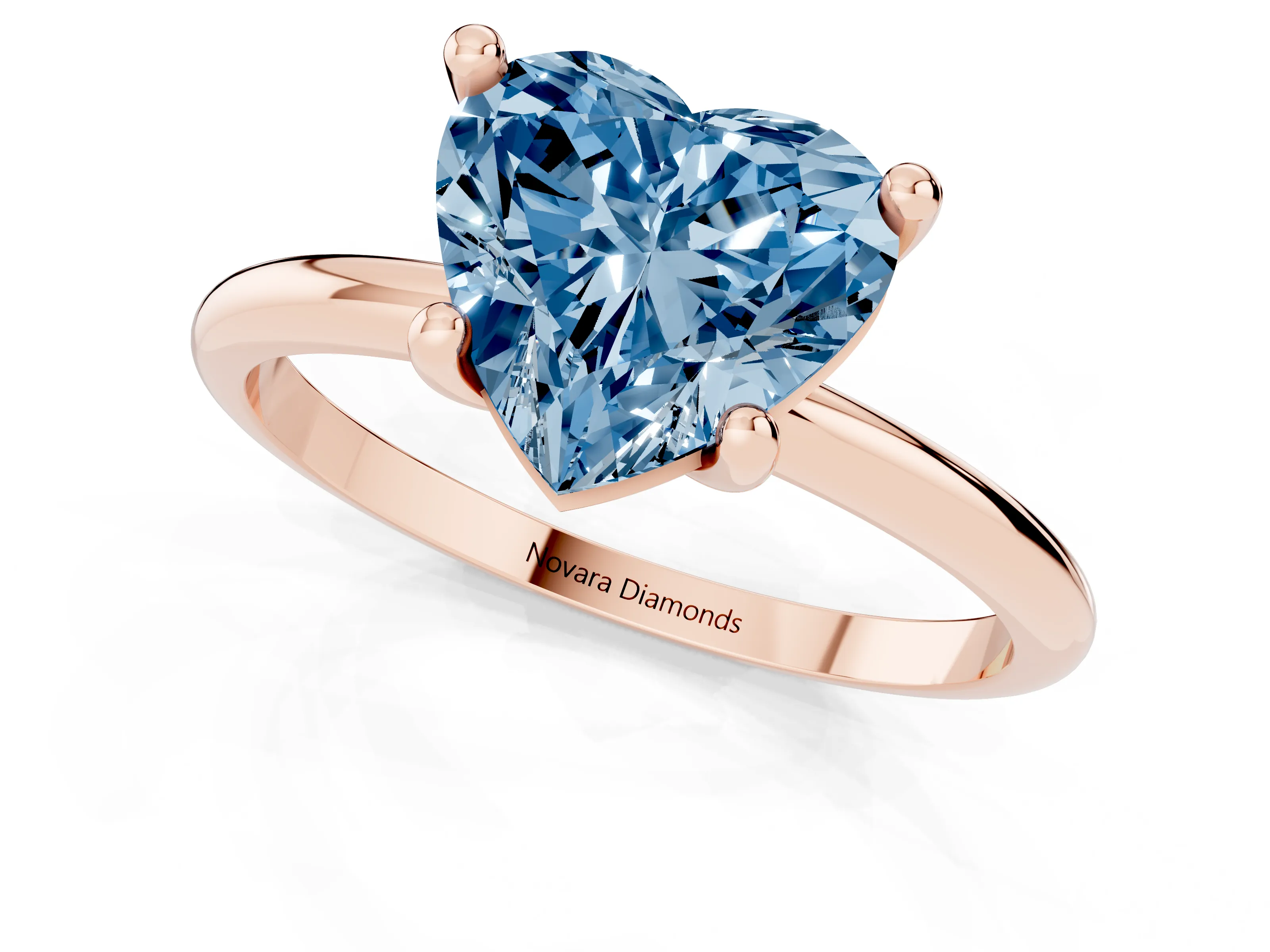 Fancy Blue Heart Cut Diamond Solitaire Ring Set in Rose gold with Secure Prong Setting on a Classic Band