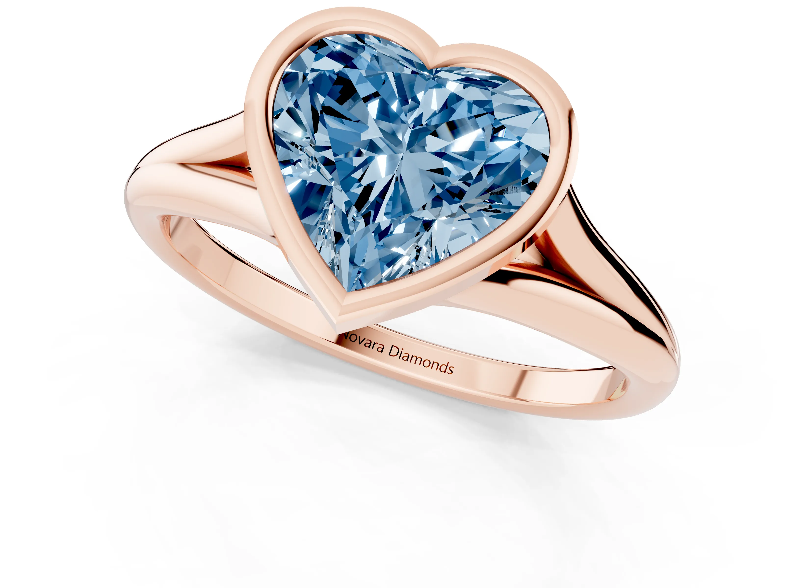 Fancy Blue Bezel Set Heart Cut Diamond Solitaire Ring Set in Rose gold with Tapered Band