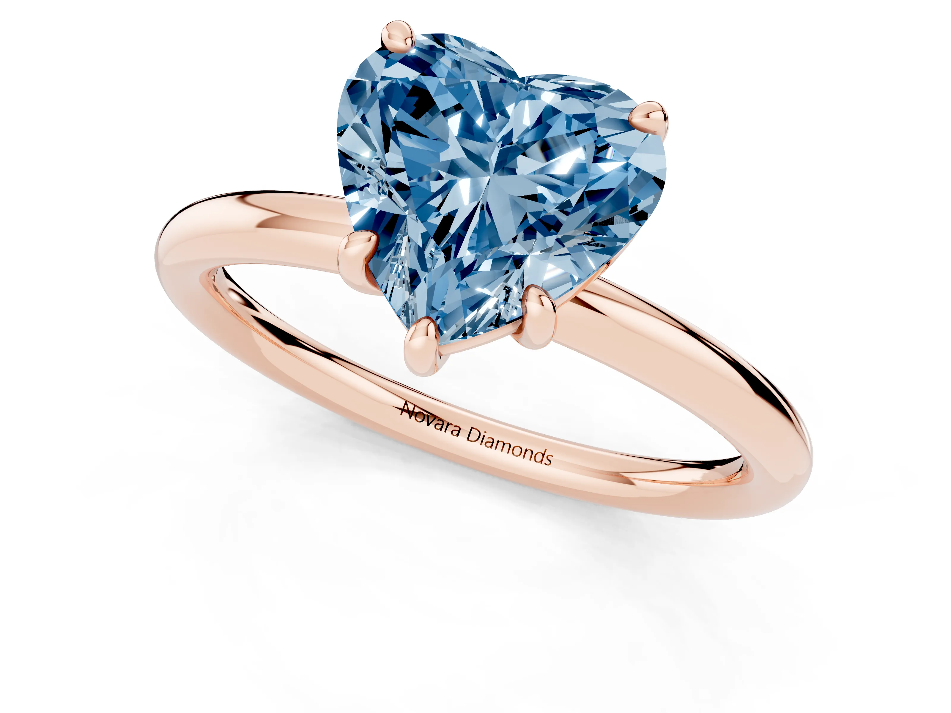 Fancy Blue Heart Cut Diamond Solitaire Ring Set in Rose gold with Prong Setting on a Polished Plain Band
