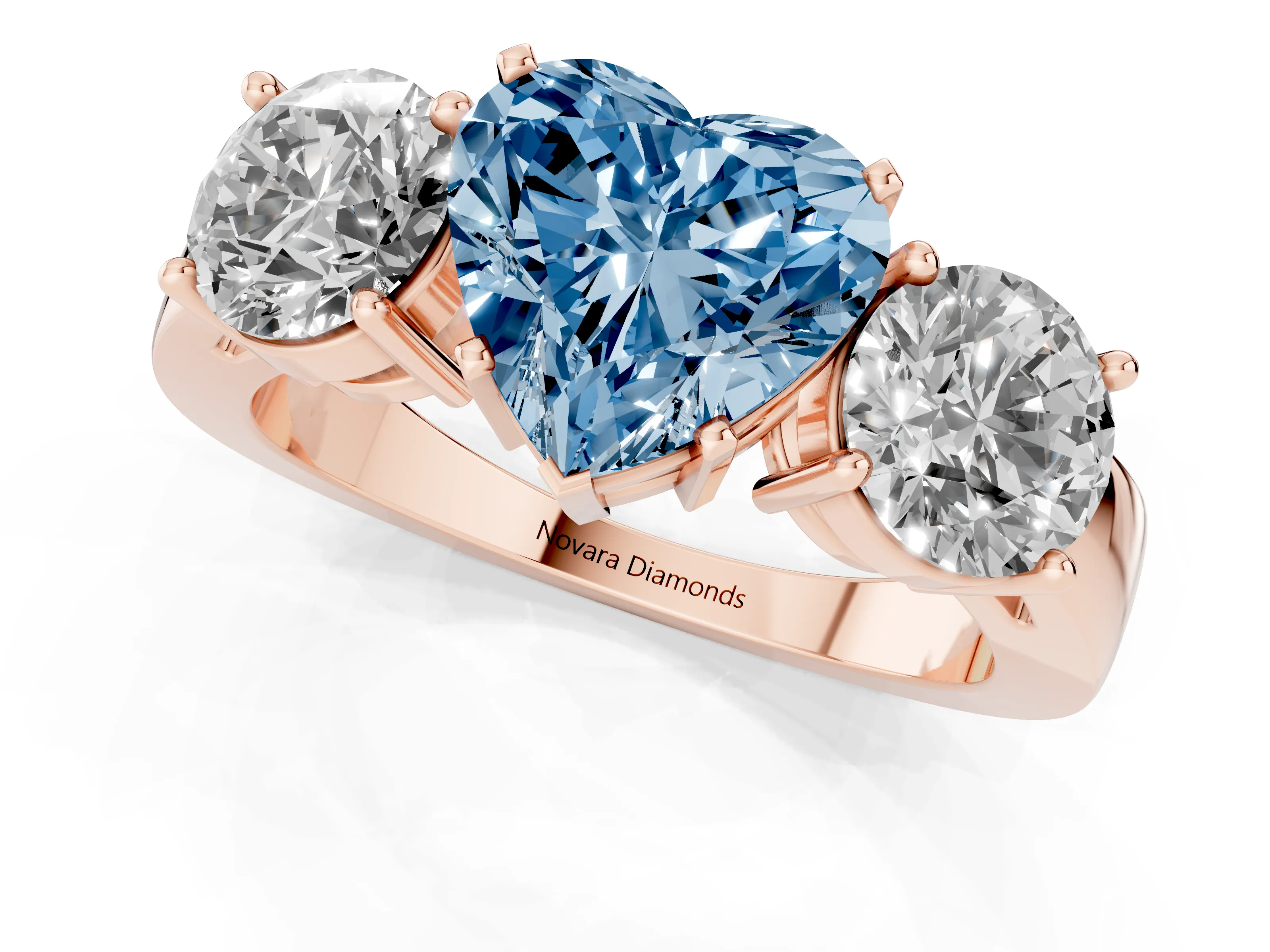 Fancy Blue Heart Cut Diamond Three-Stone Ring Set in Rose gold with Round Side Stones and Classic Band