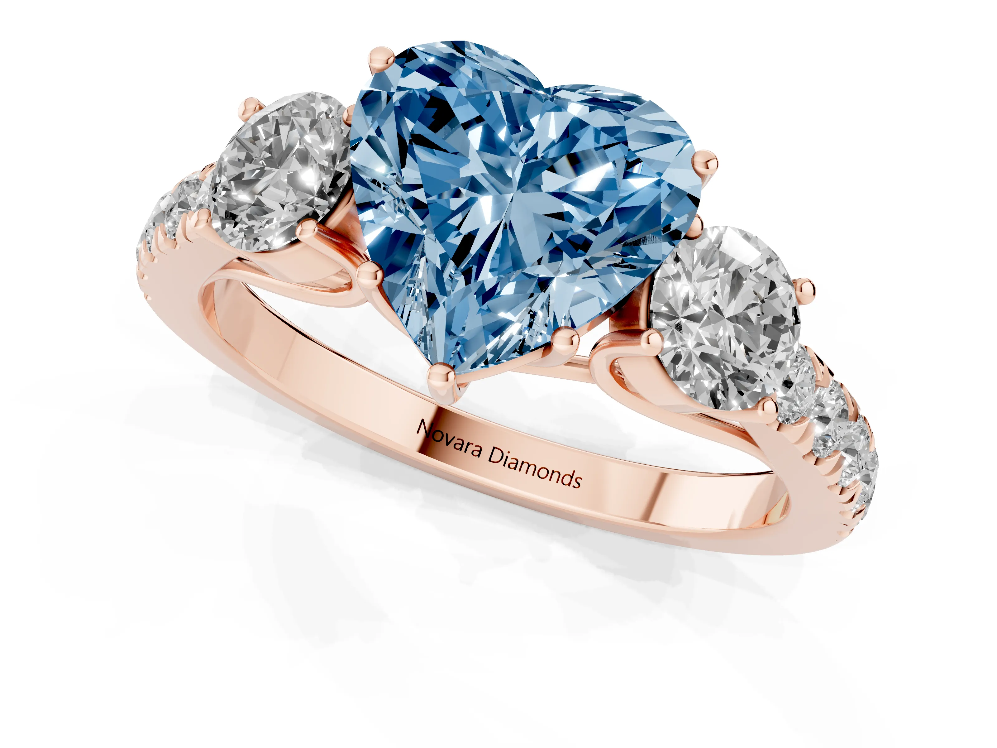 Fancy Blue Heart Cut Diamond Three-Stone Ring Set in Rose gold with Round Side Stones and Delicate Pavé Band