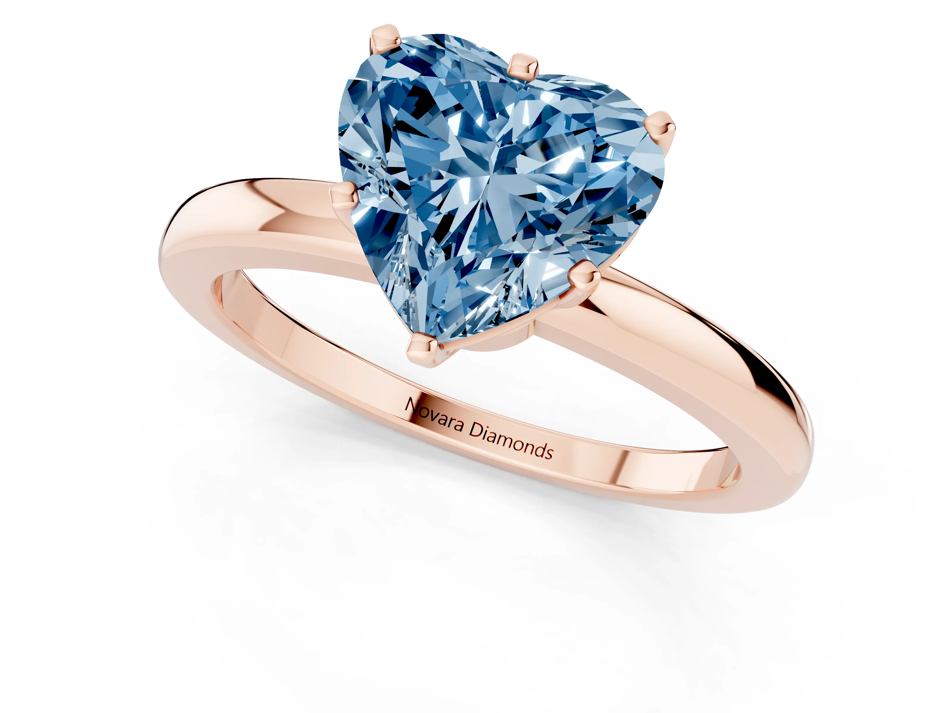 Fancy Blue Heart Cut Diamond Solitaire Ring Set in Rose gold with Raised Prong Setting on a Classic Band