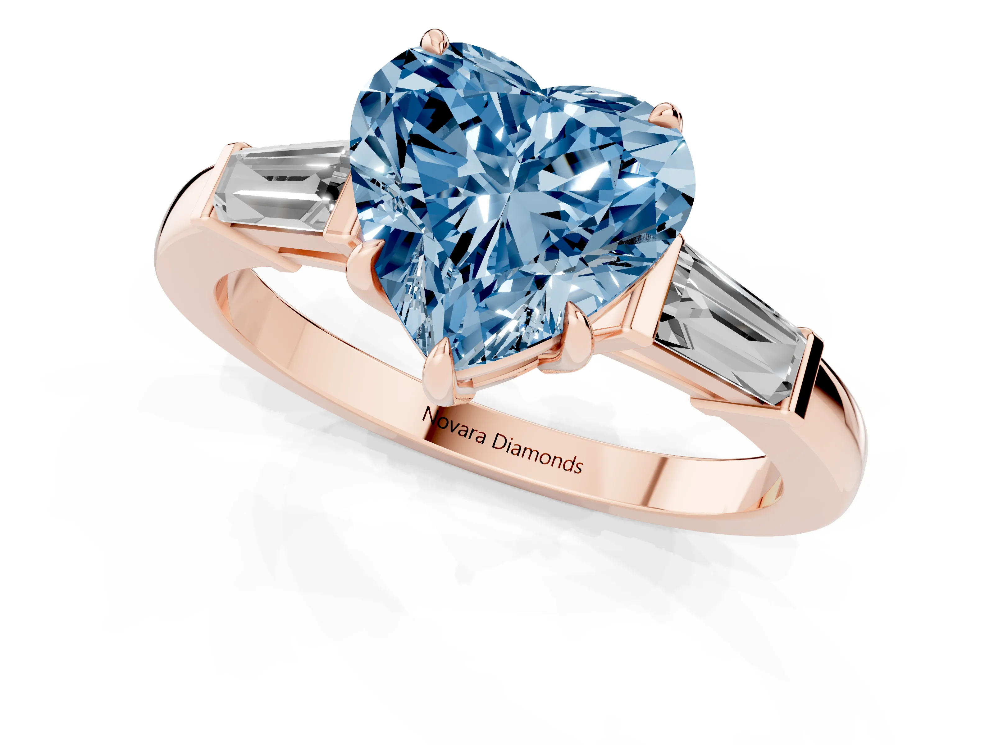 Fancy Blue Heart Cut Diamond Three-Stone Ring Set in Rose gold with Tapered Baguette Side Stones and Prong Setting