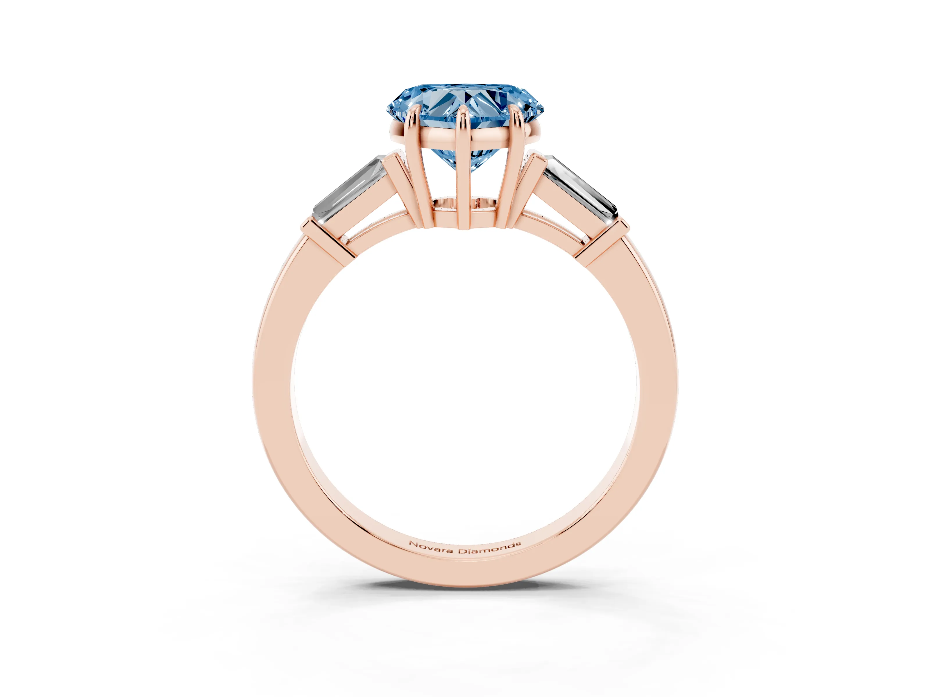 Fancy Blue Heart Cut Diamond Three-Stone Ring Set in Rose gold with Tapered Baguette Side Stones and Prong Setting