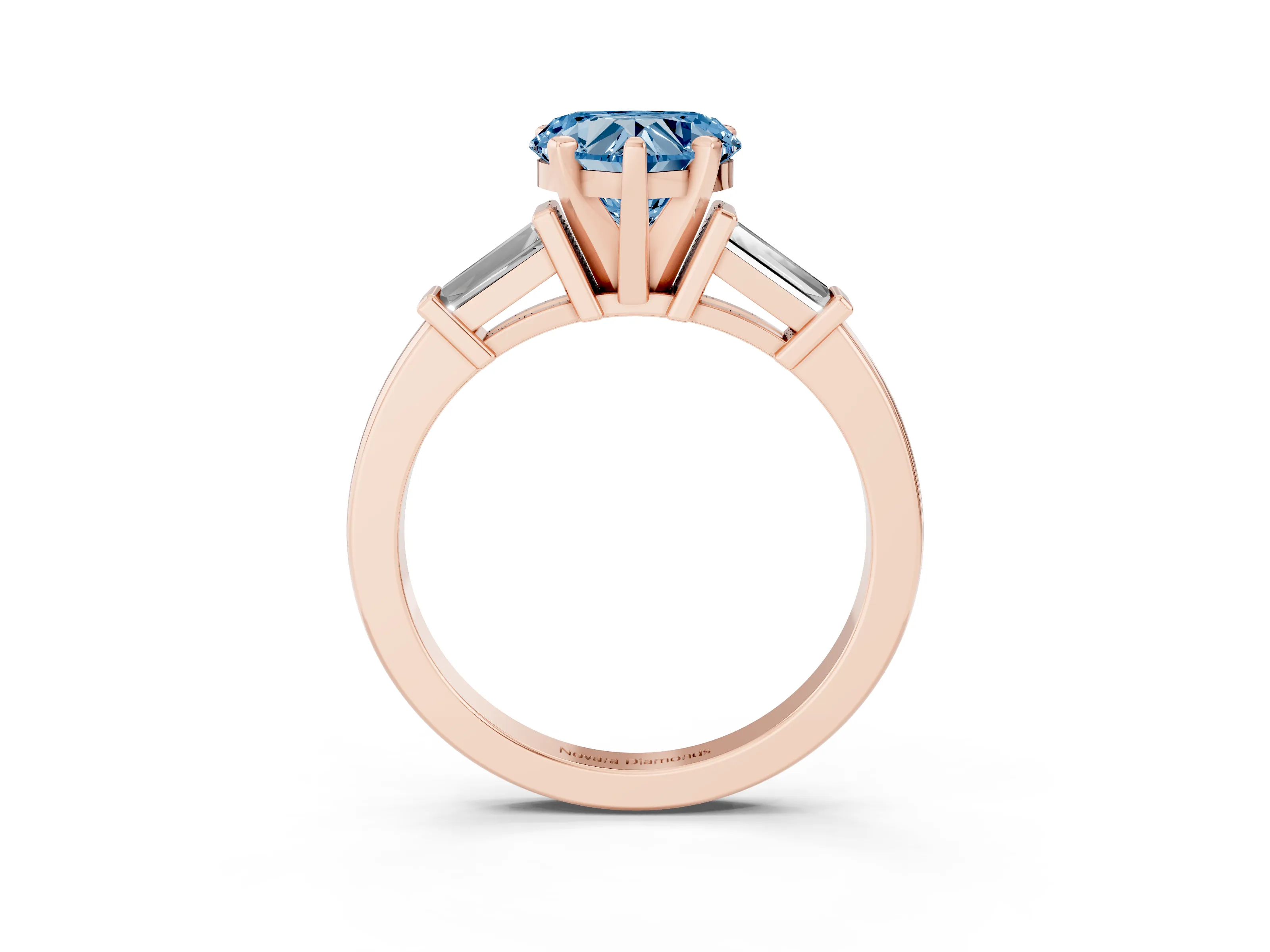 Fancy Blue Heart Cut Diamond Solitaire Ring Set in Rose gold with Tapered Baguette Accents and Prong Setting