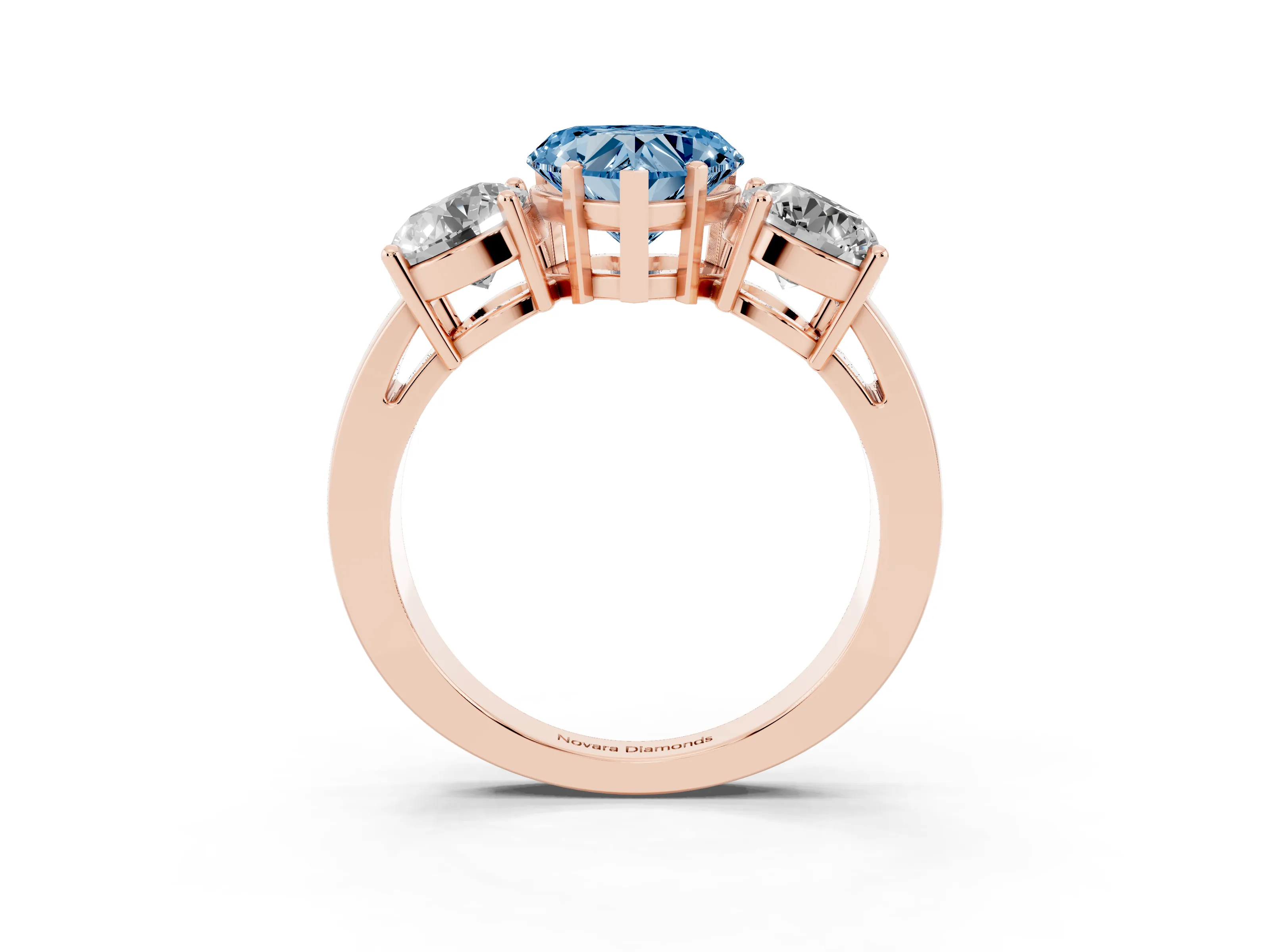 Fancy Blue Heart Cut Diamond Three-Stone Ring Set in Rose gold with Round Side Stones and Classic Band