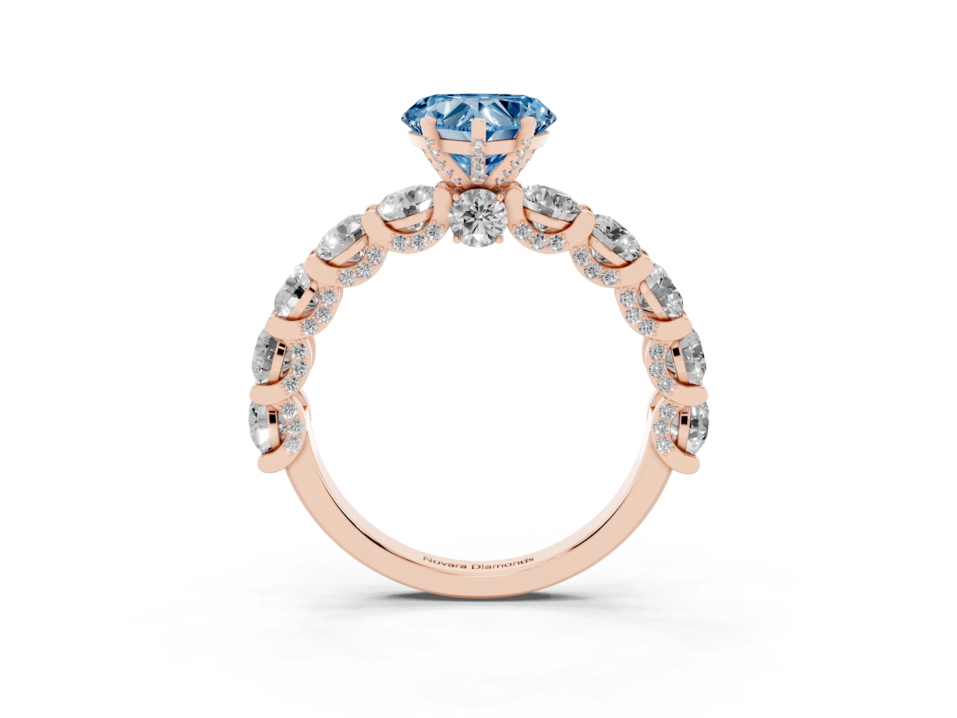 Fancy Blue Heart Cut Diamond Side Stone Ring Set in Rose gold with Alternating Round and Oval Side Stones