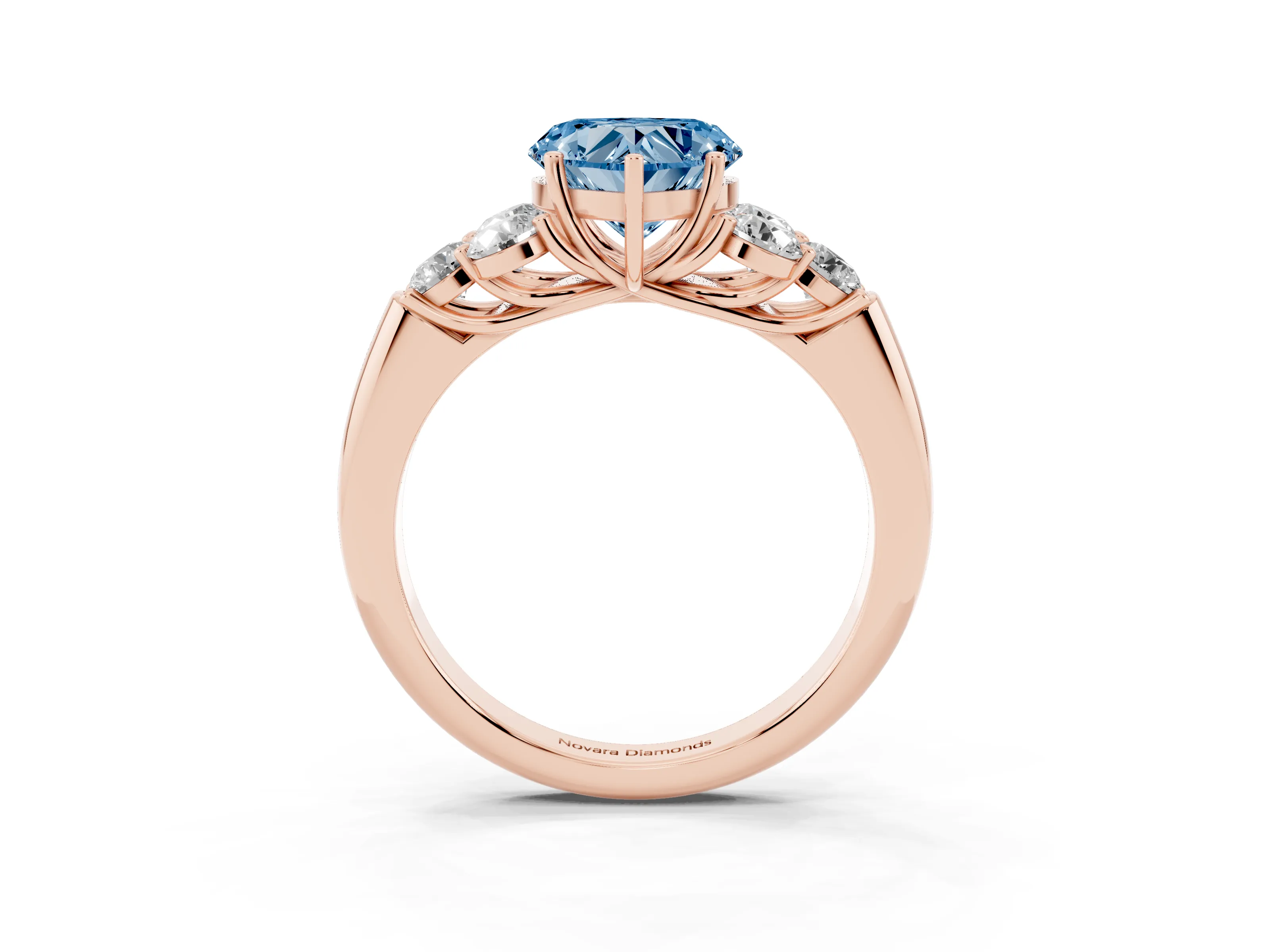 Fancy Blue Heart Cut Diamond Cluster Ring Set in Rose gold with Round Accent Stones and Prong Setting on a Plain Band
