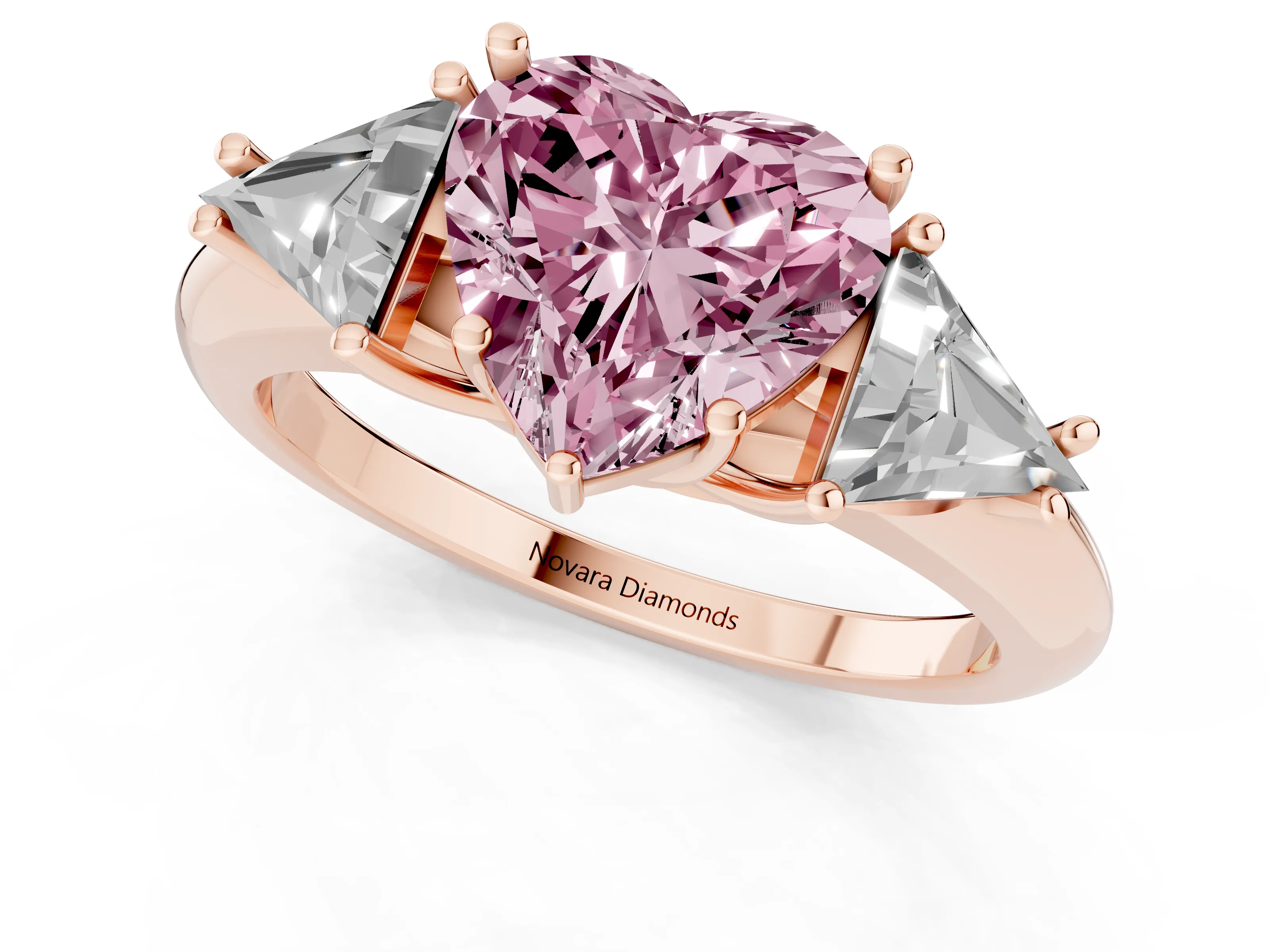 Fancy Pink Heart Cut Diamond Three-Stone Engagement Ring Set in Rose gold with Trillion Side Stones