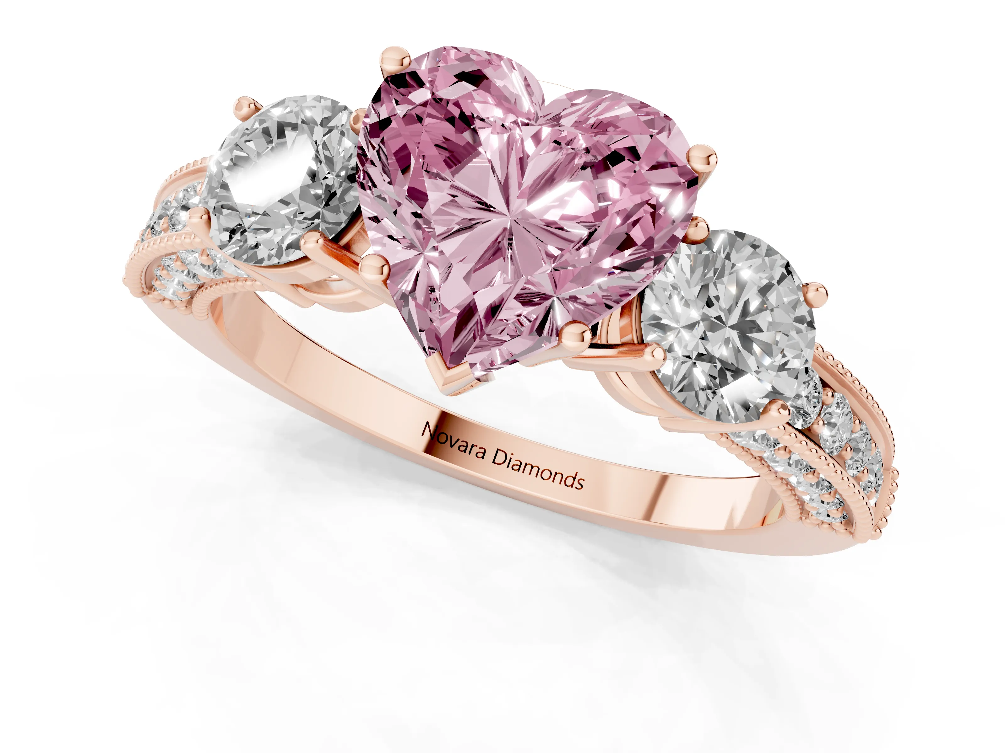 Fancy Pink Heart Cut Diamond Three-Stone Ring Set in Rose gold with Round Side Stones and Pavé Band