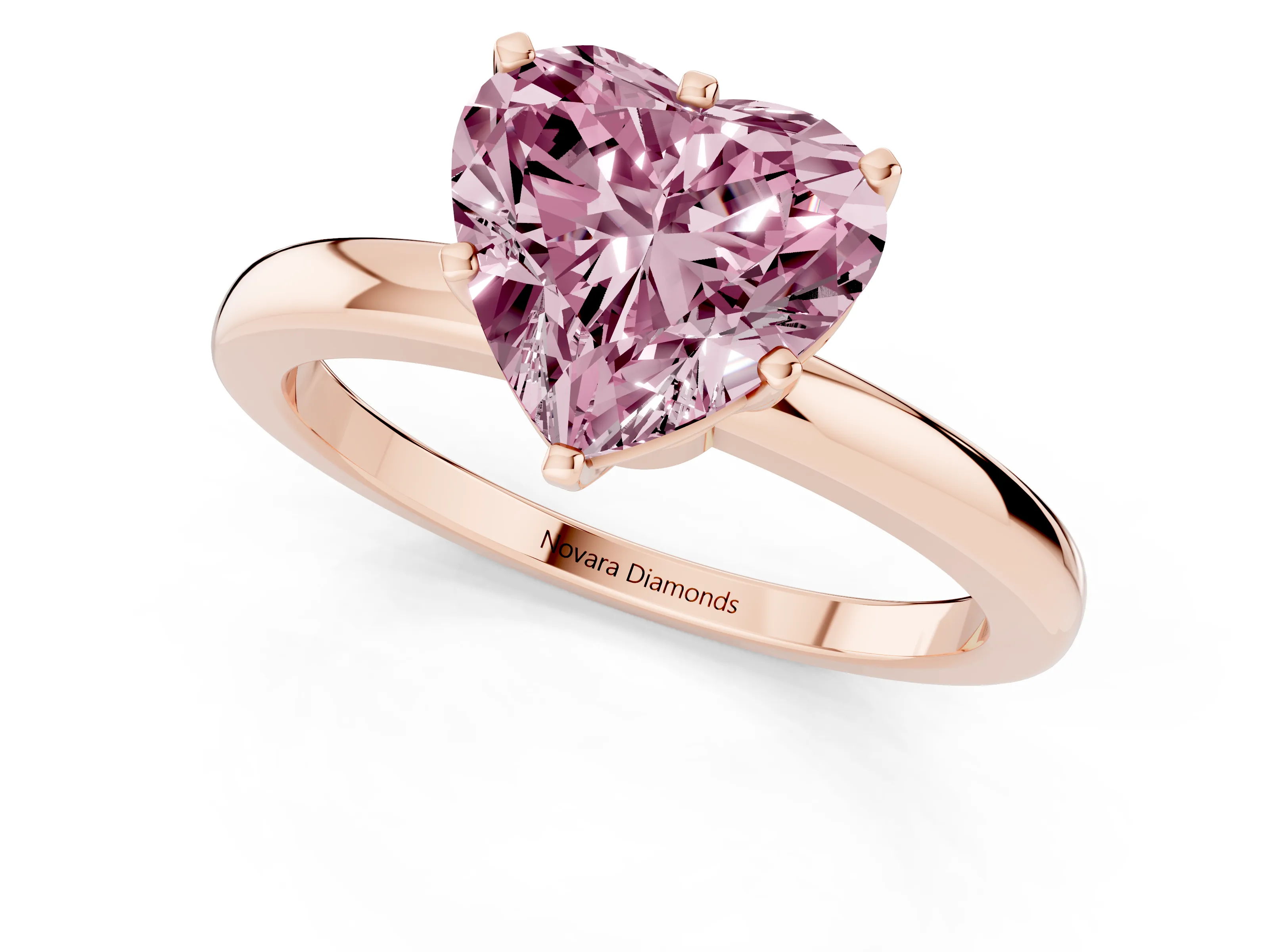 Fancy Pink Heart Cut Diamond Solitaire Ring Set in Rose gold with Raised Prong Setting on a Classic Band