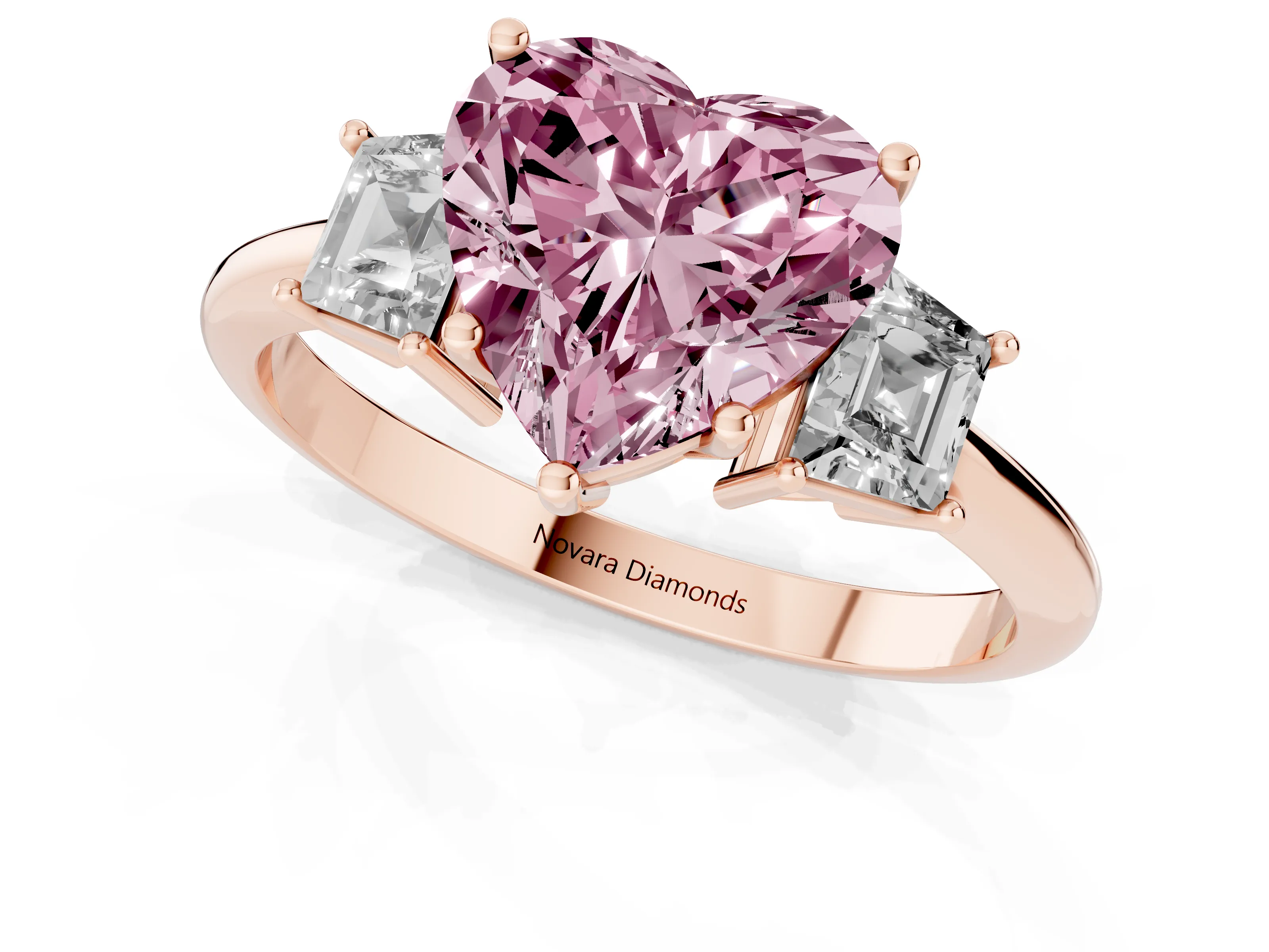 Fancy Pink Heart Cut Diamond Three-Stone Ring Set in Rose gold with Trapezoid Side Stones and Prong Setting