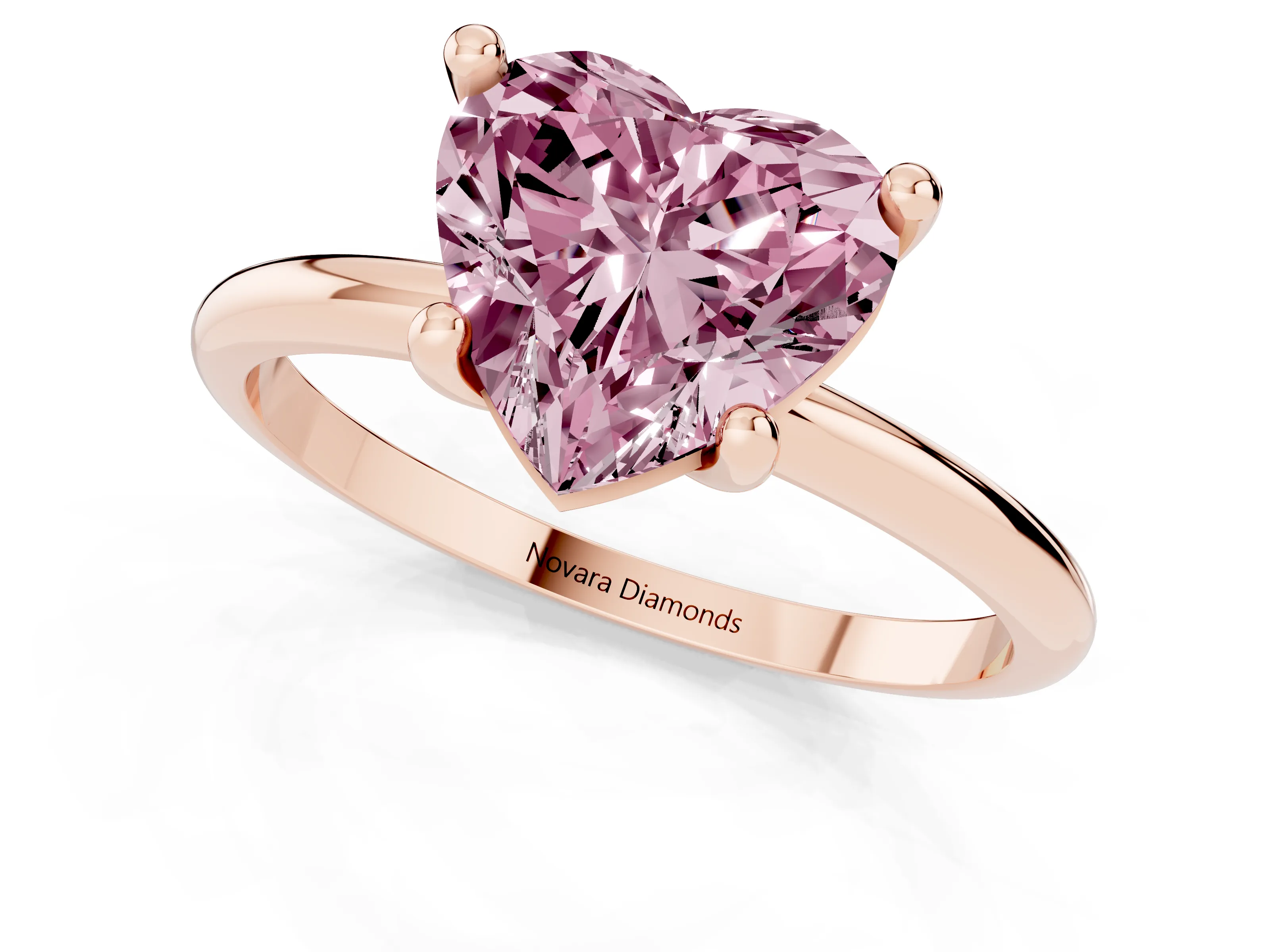 Fancy Pink Heart Cut Diamond Solitaire Ring Set in Rose gold with Secure Prong Setting on a Classic Band