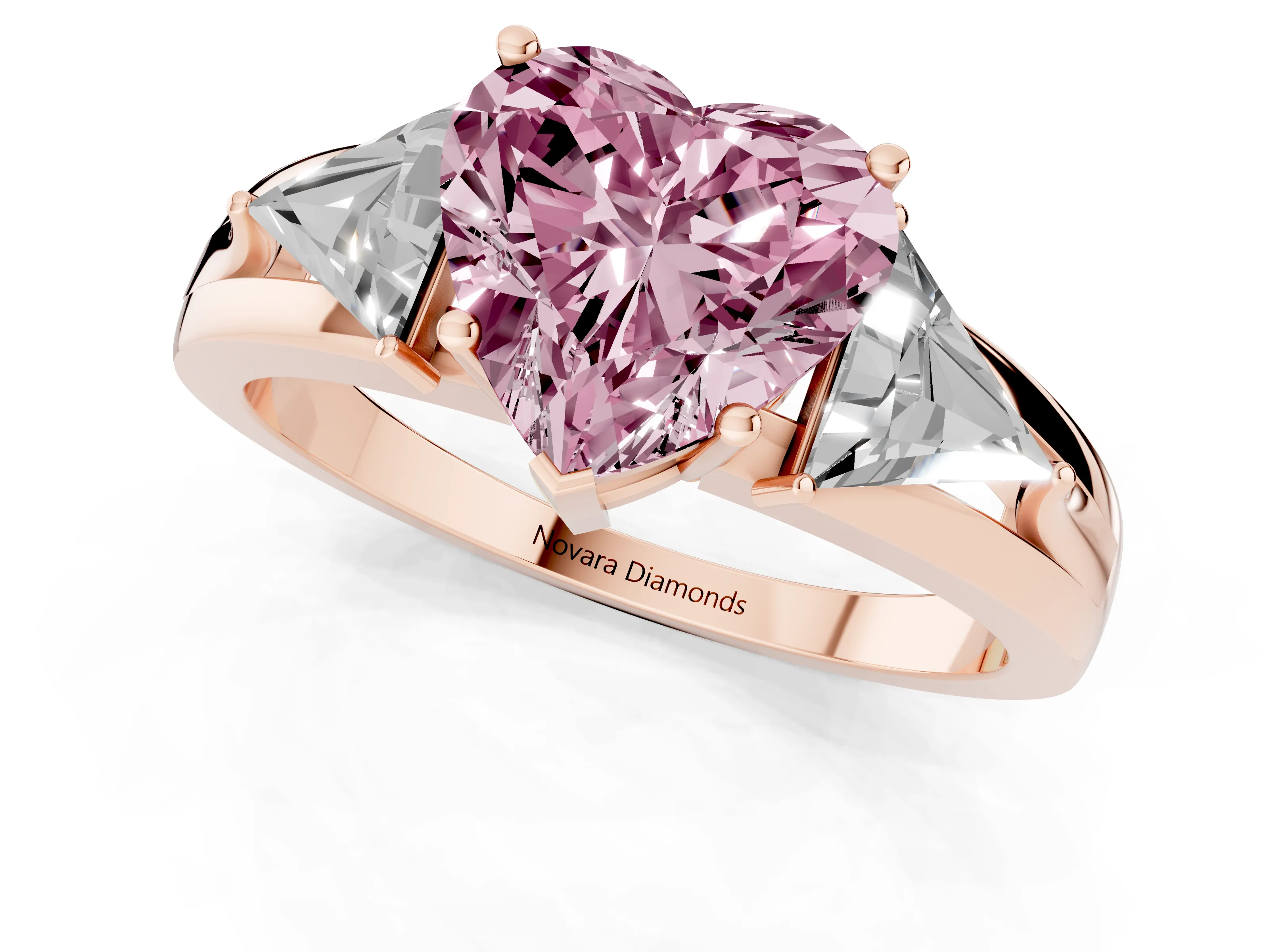 Fancy Pink Heart Cut Diamond Three-Stone Ring Set in Rose gold with Trillion Side Stones and Split Shank
