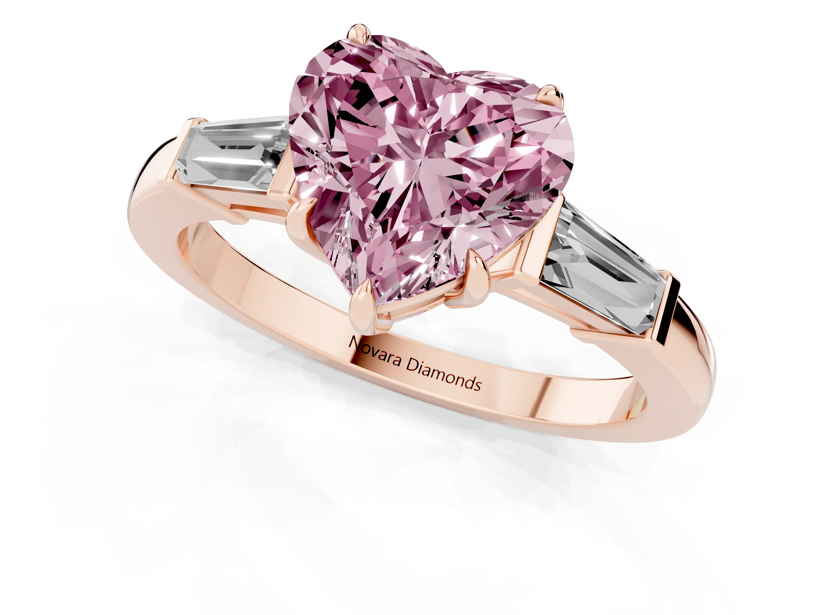 Fancy Pink Heart Cut Diamond Three-Stone Ring Set in Rose gold with Tapered Baguette Side Stones and Prong Setting