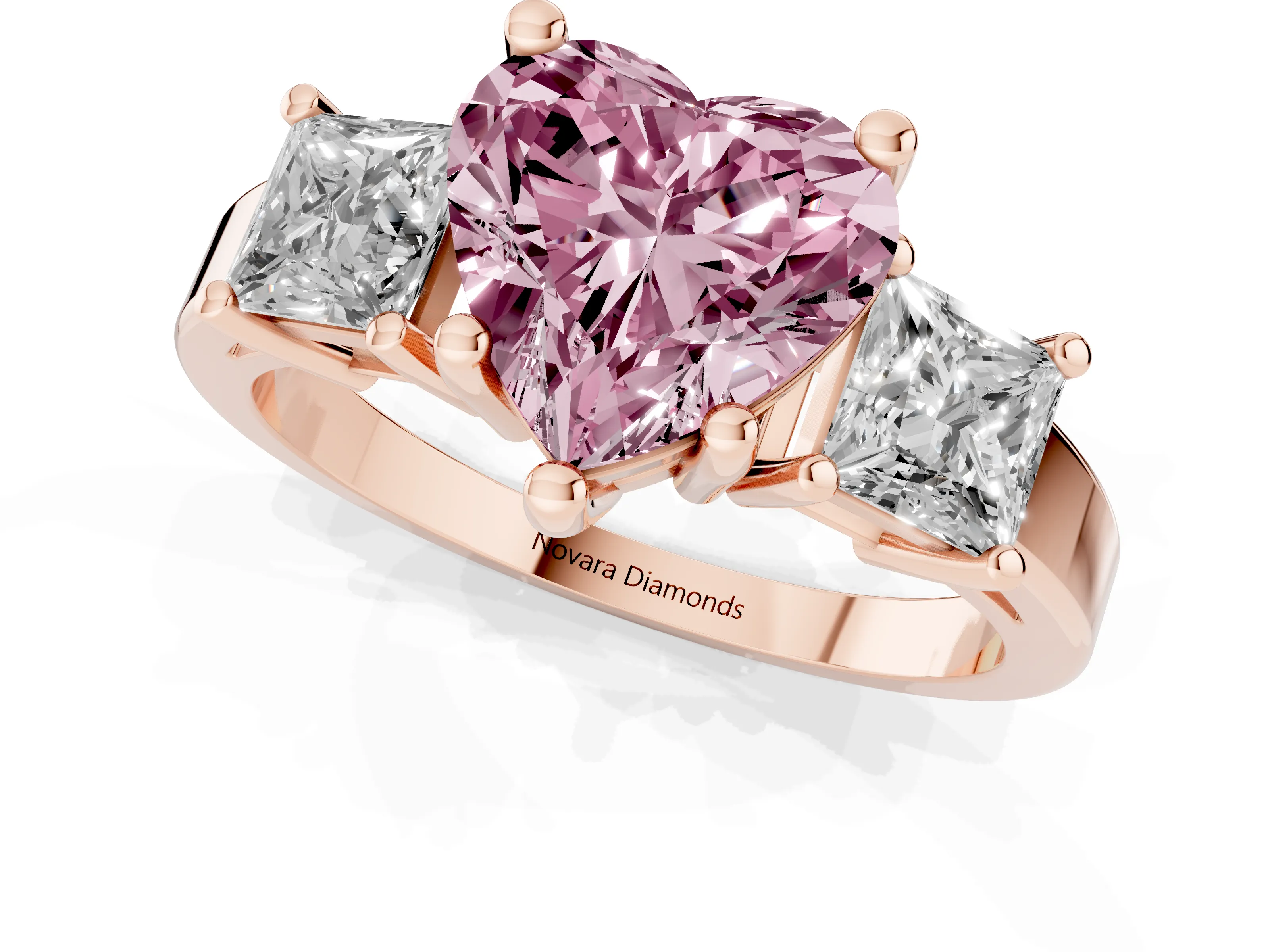 Fancy Pink Three-Stone Heart Cut Diamond Solitaire Ring Set in Rose gold with Prong Setting