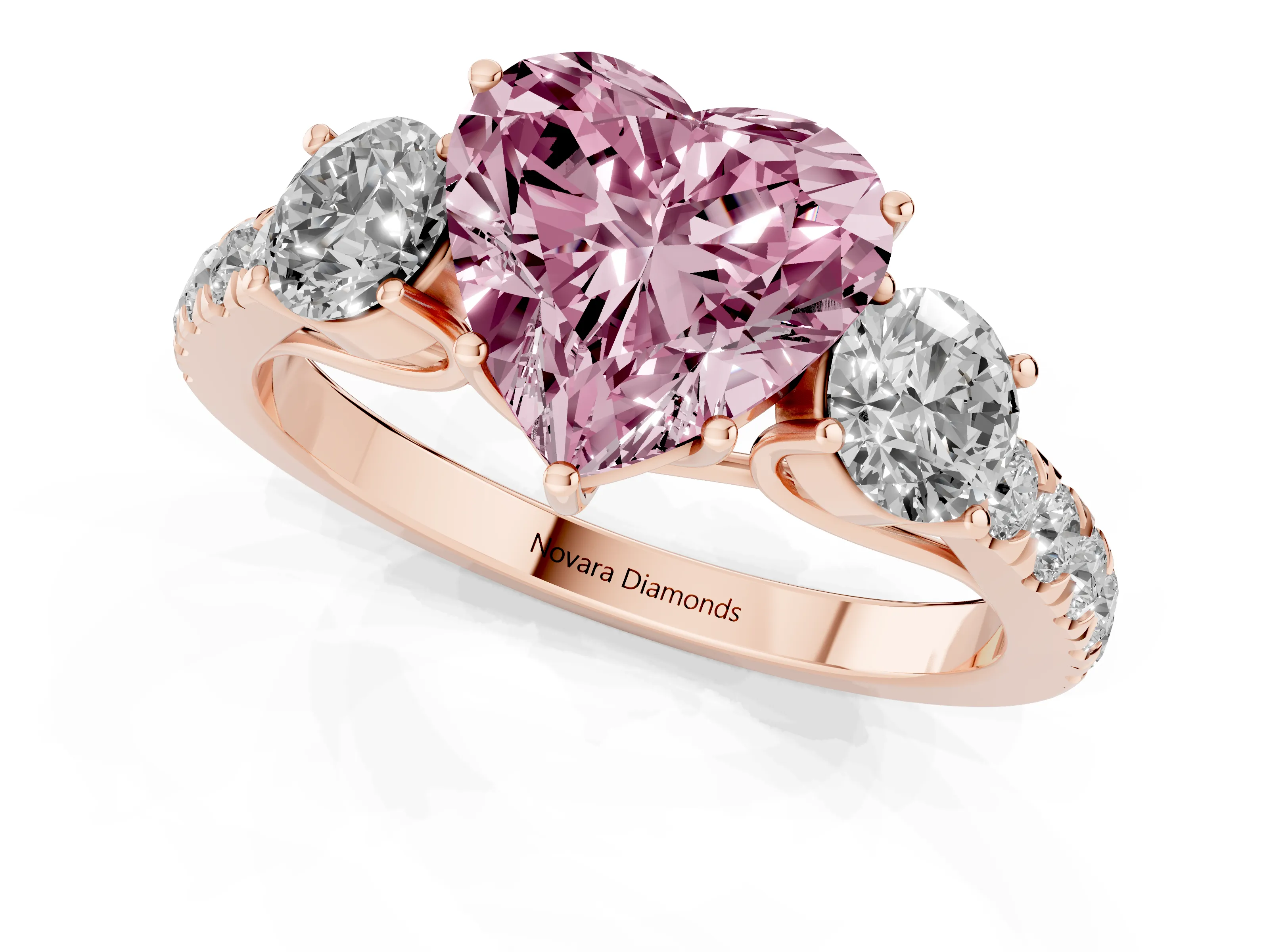 Fancy Pink Heart Cut Diamond Three-Stone Ring Set in Rose gold with Round Side Stones and Delicate Pavé Band