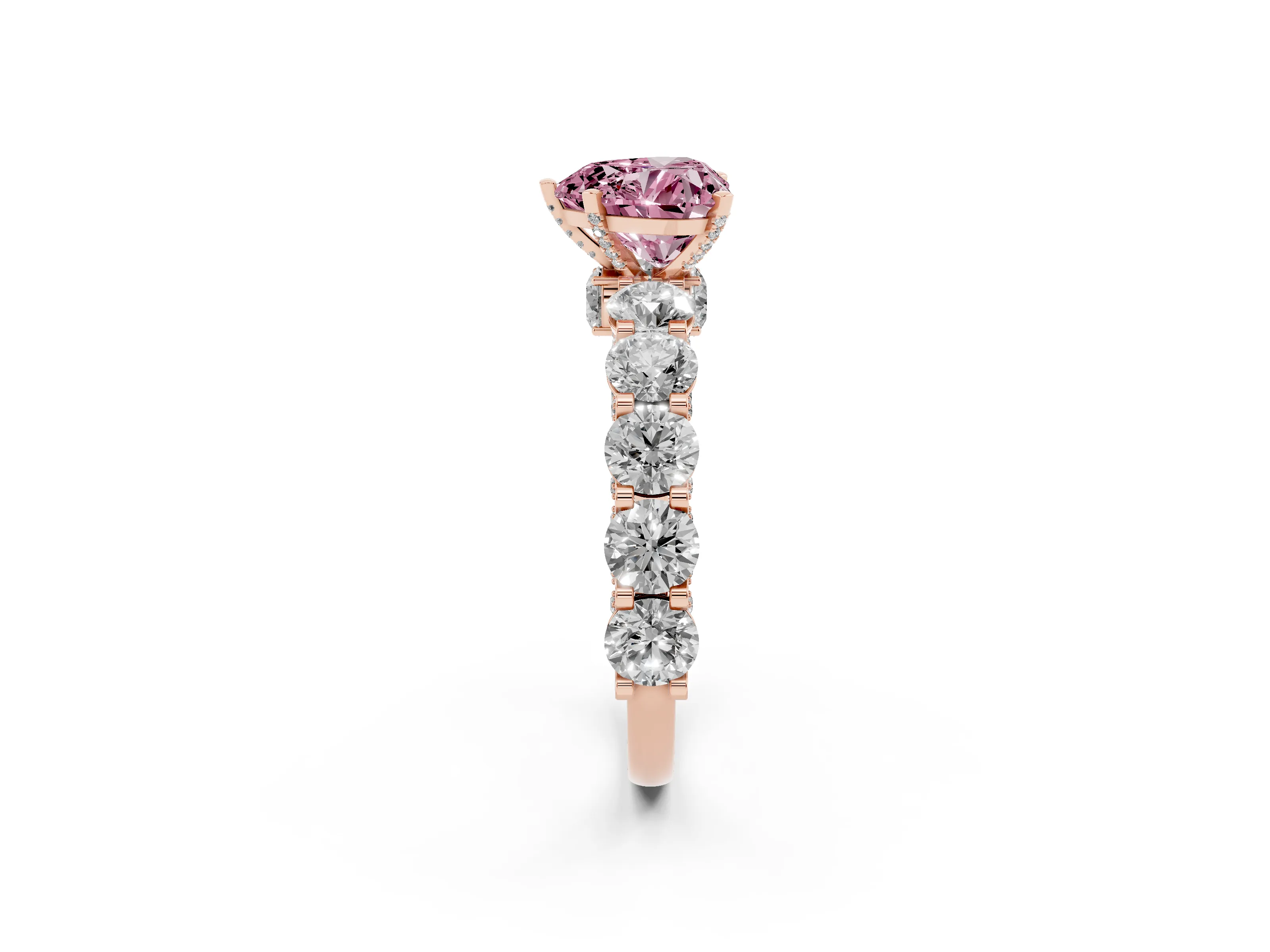 Fancy Pink Heart Cut Diamond Side Stone Ring Set in Rose gold with Alternating Round and Oval Side Stones