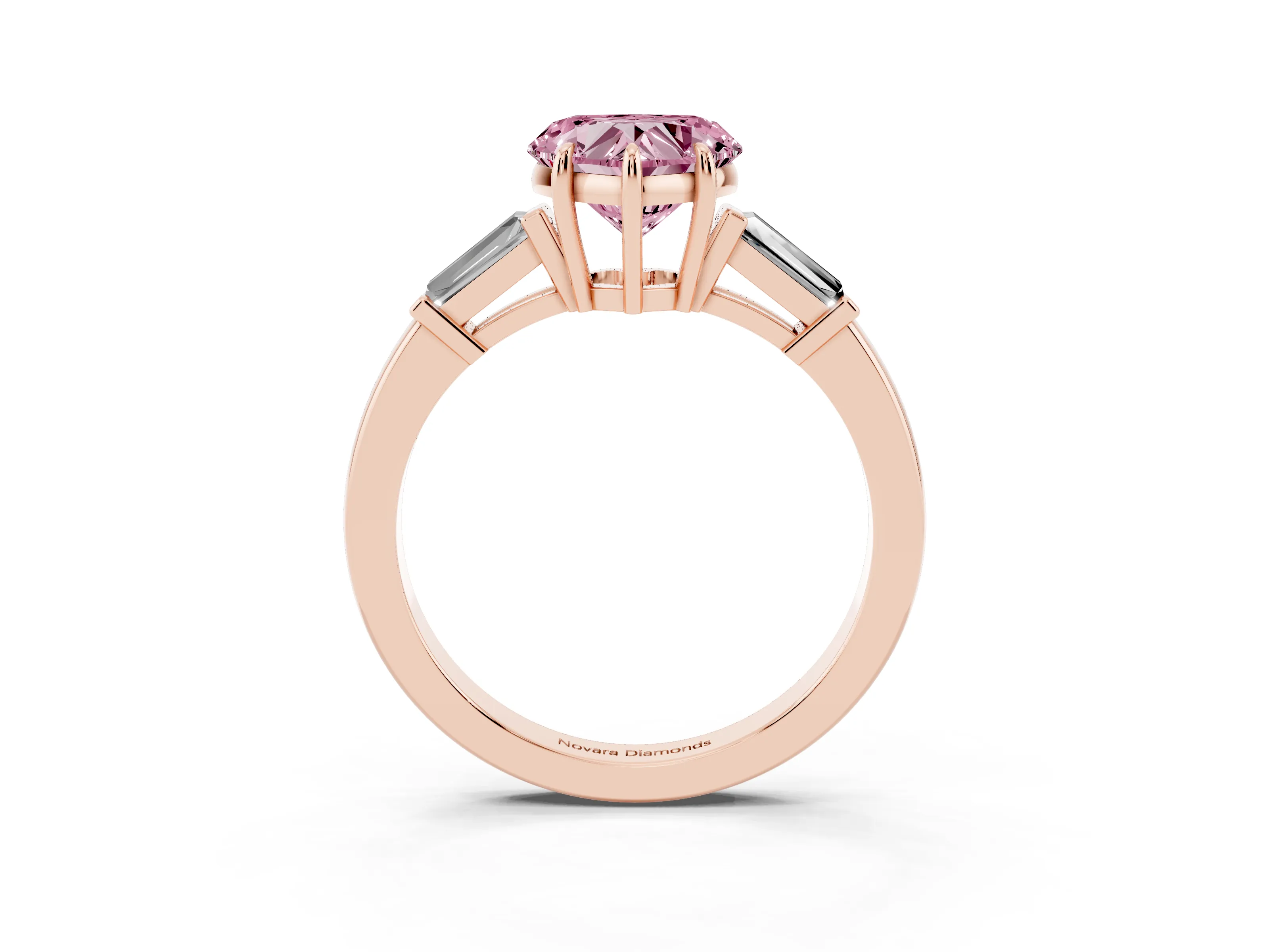 Fancy Pink Heart Cut Diamond Three-Stone Ring Set in Rose gold with Tapered Baguette Side Stones and Prong Setting
