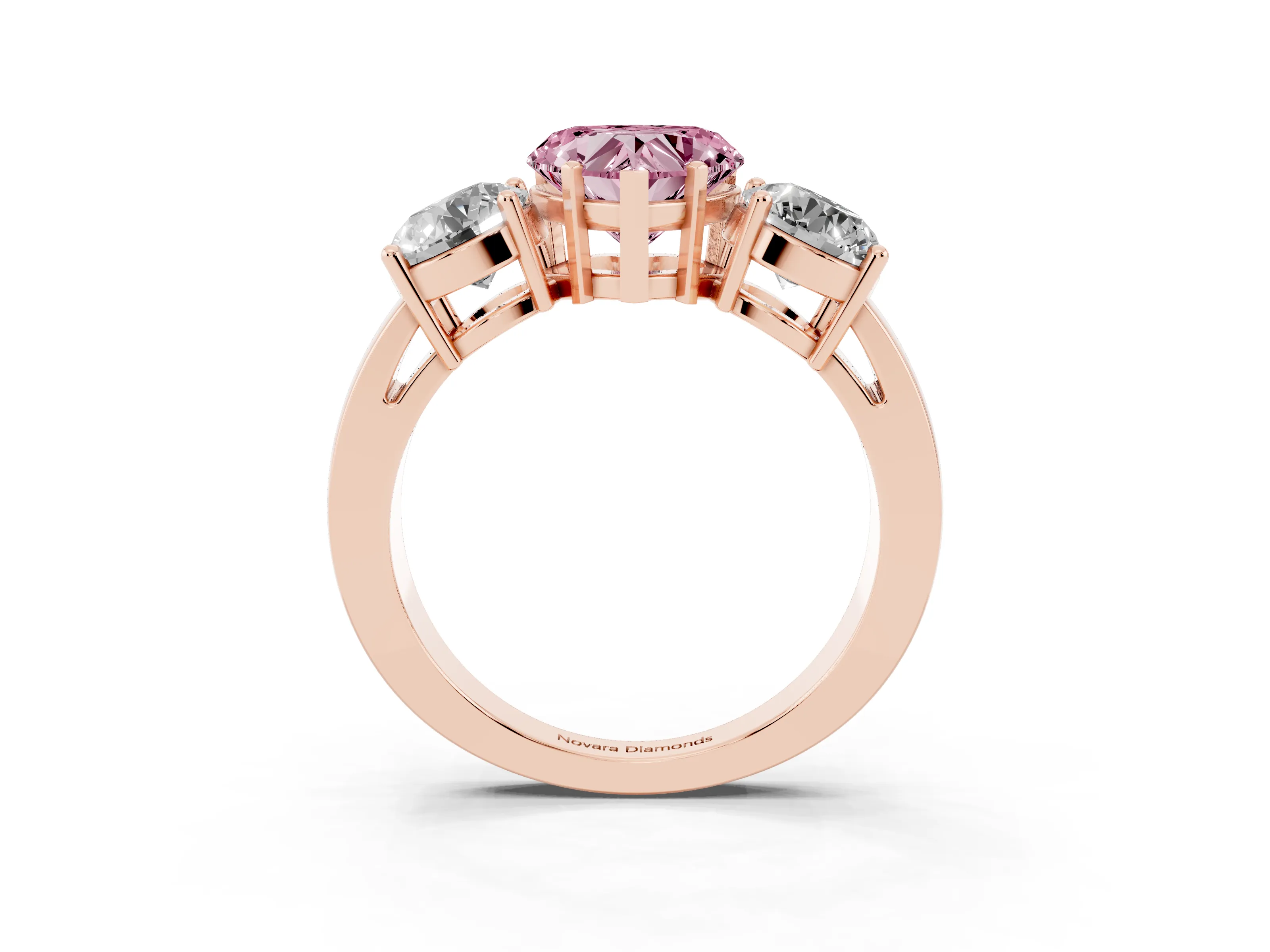 Fancy Pink Heart Cut Diamond Three-Stone Ring Set in Rose gold with Round Side Stones and Classic Band