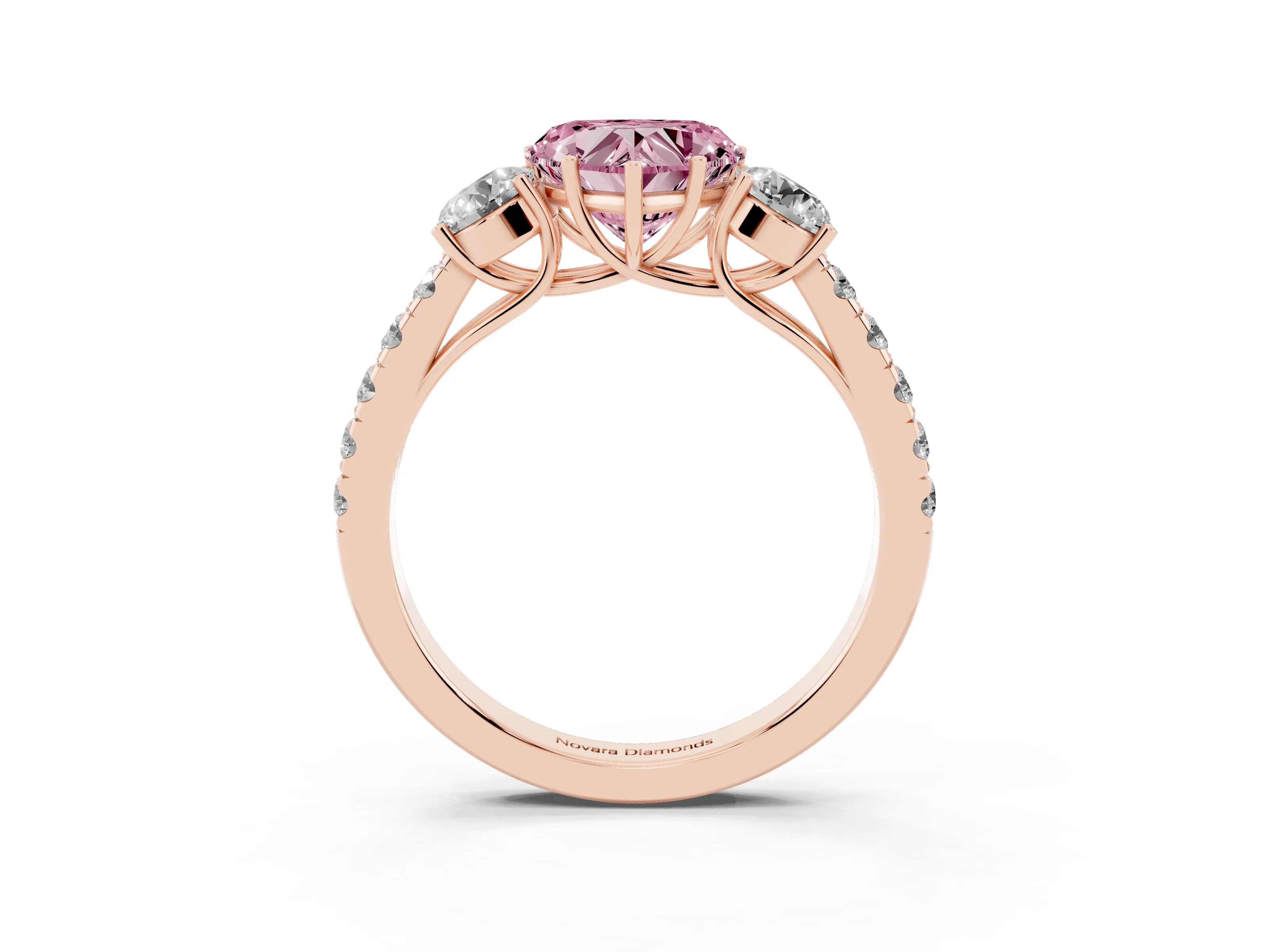 Fancy Pink Heart Cut Diamond Three-Stone Ring Set in Rose gold with Round Side Stones and Delicate Pavé Band